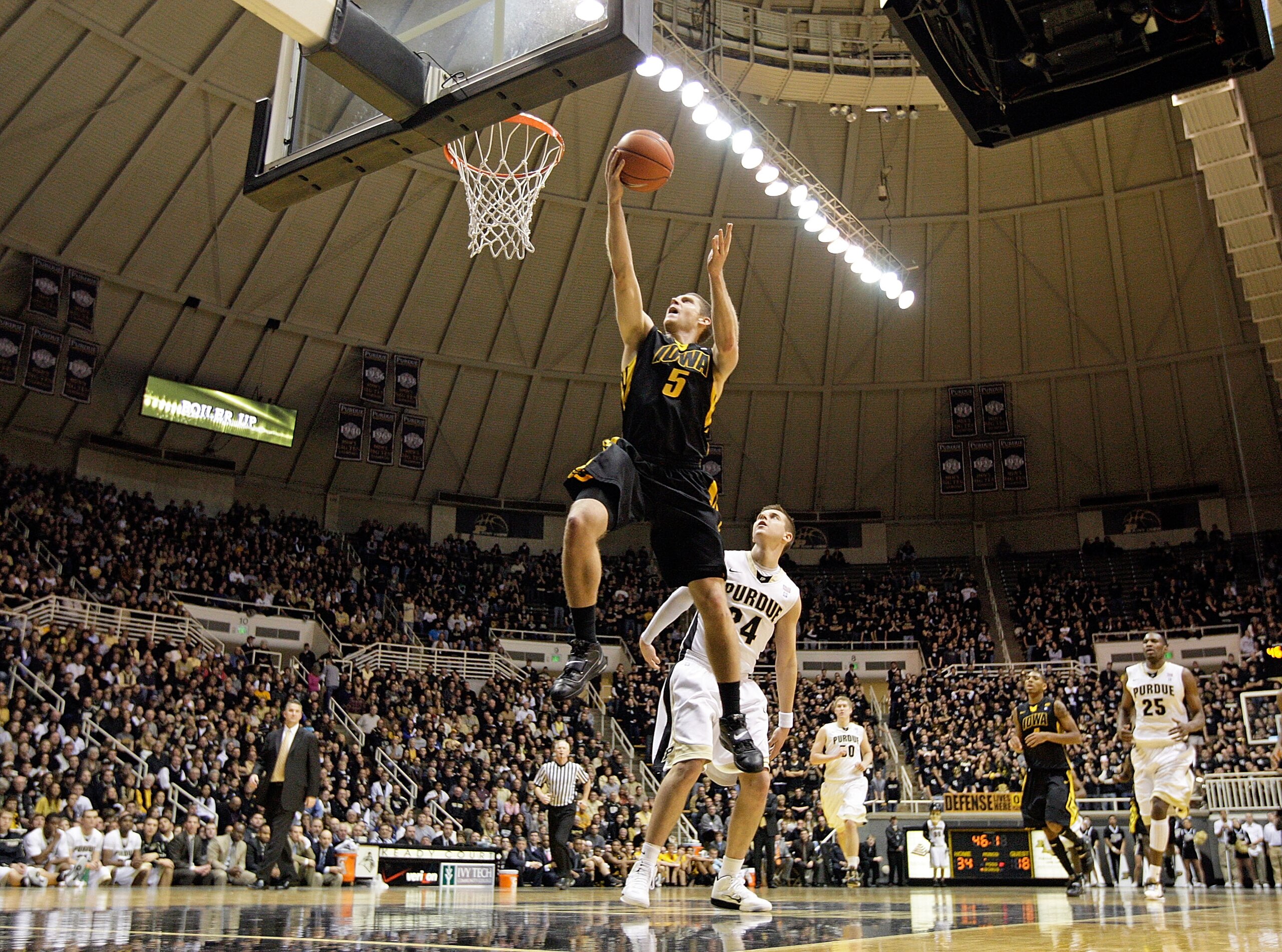 WEST LAFAYETTE, IN - JANUARY 09:  Matt Gatens #5 of the Iowa Hawkeyes drives for a shot attempt during the Big Ten Conference game against the Purdue Boilermakers at Mackey Arena on January 9, 2011 in West Lafayette, Indiana. Purdue won 75-52. (Photo by A