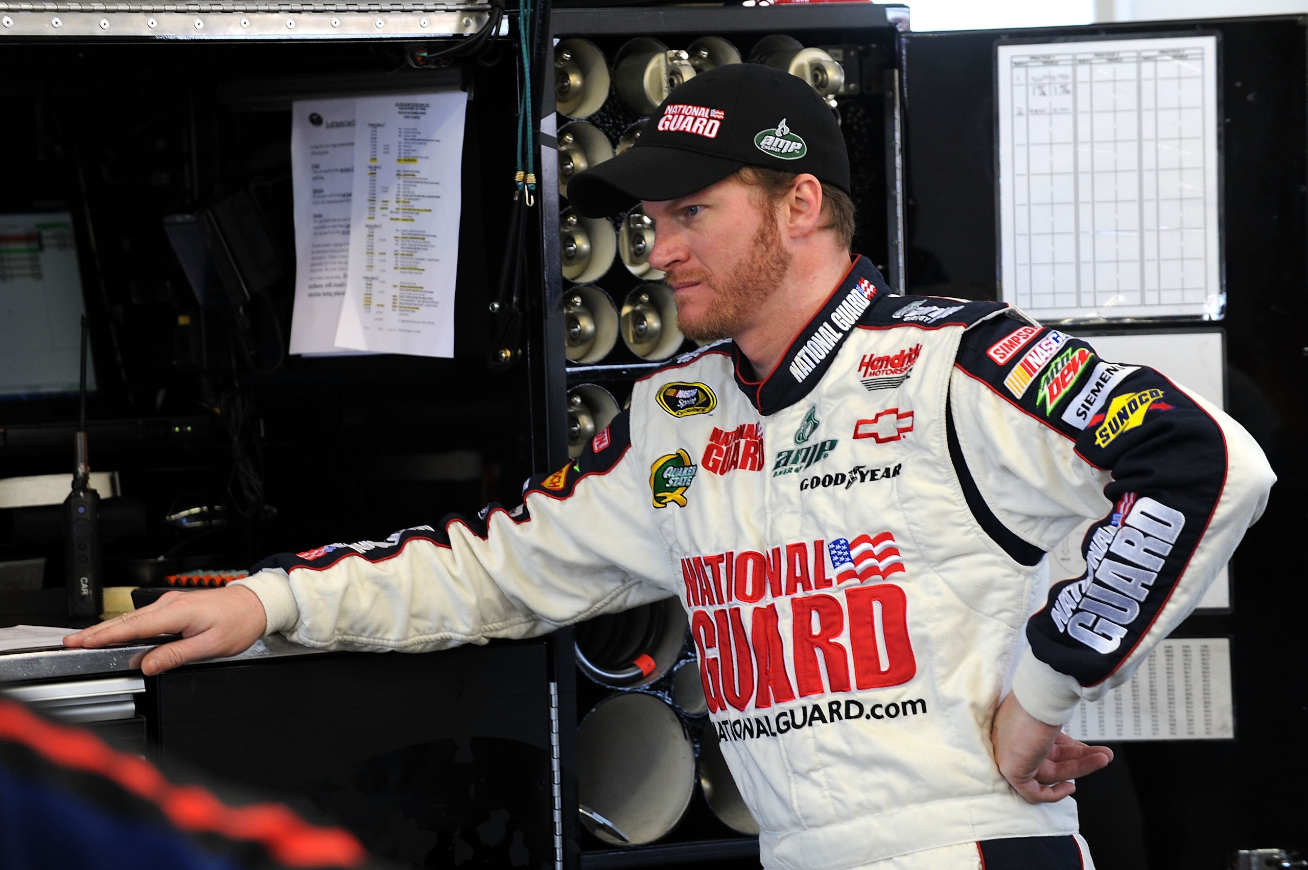 LAS VEGAS, NV - MARCH 04:  Dale Earnhardt Jr., driver of the #88 National Guard/Amp Energy Chevrolet, stands in the garage during practice for the NASCAR Sprint Cup Series Kobalt Tools 400 at Las Vegas Motor Speedway on March 4, 2011 in Las Vegas, Nevada.