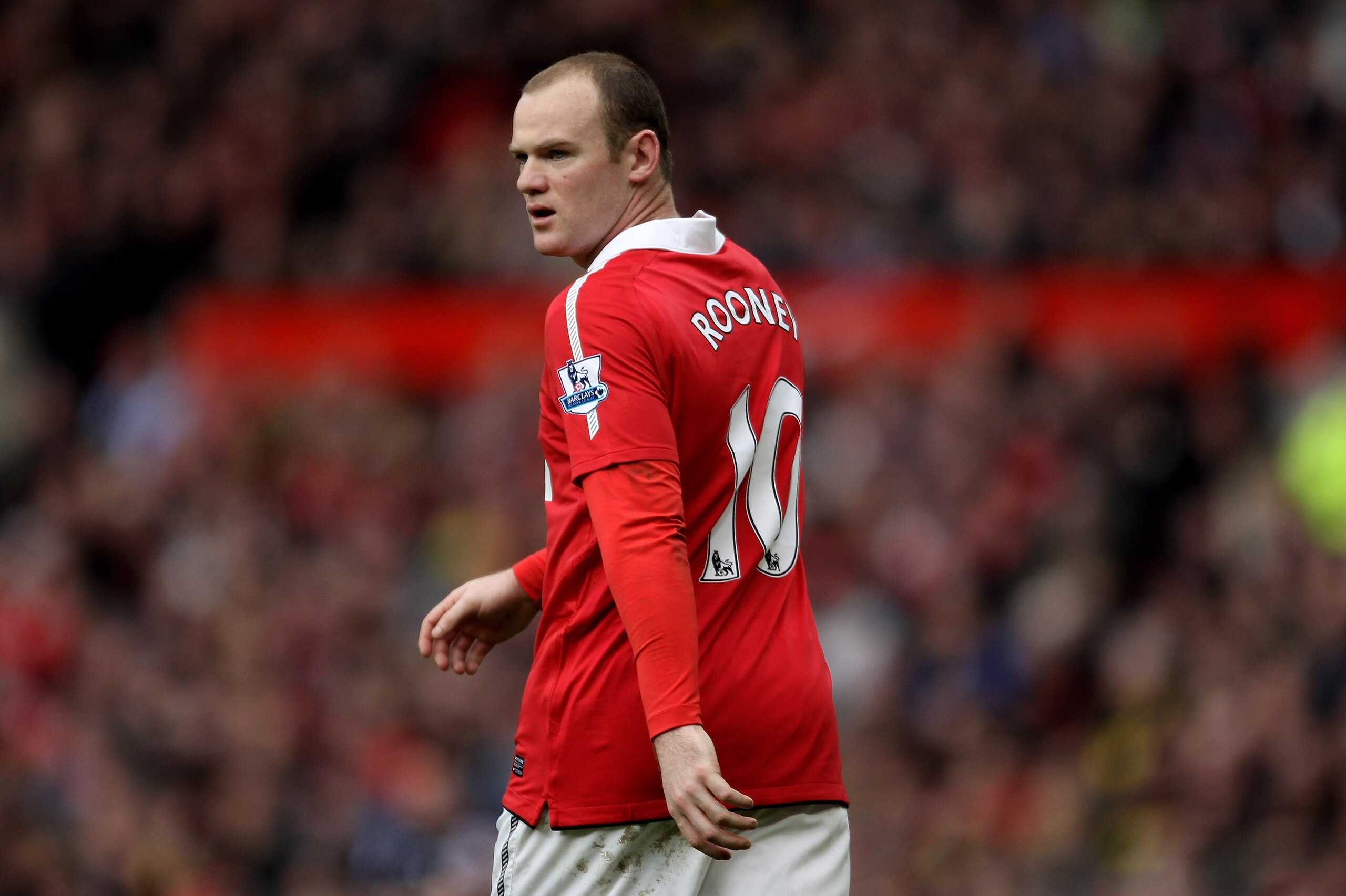 MANCHESTER, ENGLAND - FEBRUARY 12:  Wayne Rooney of Manchester United reacts during the Barclays Premier League match between Manchester United and Manchester City at Old Trafford on February 12, 2011 in Manchester, England.  (Photo by Alex Livesey/Getty