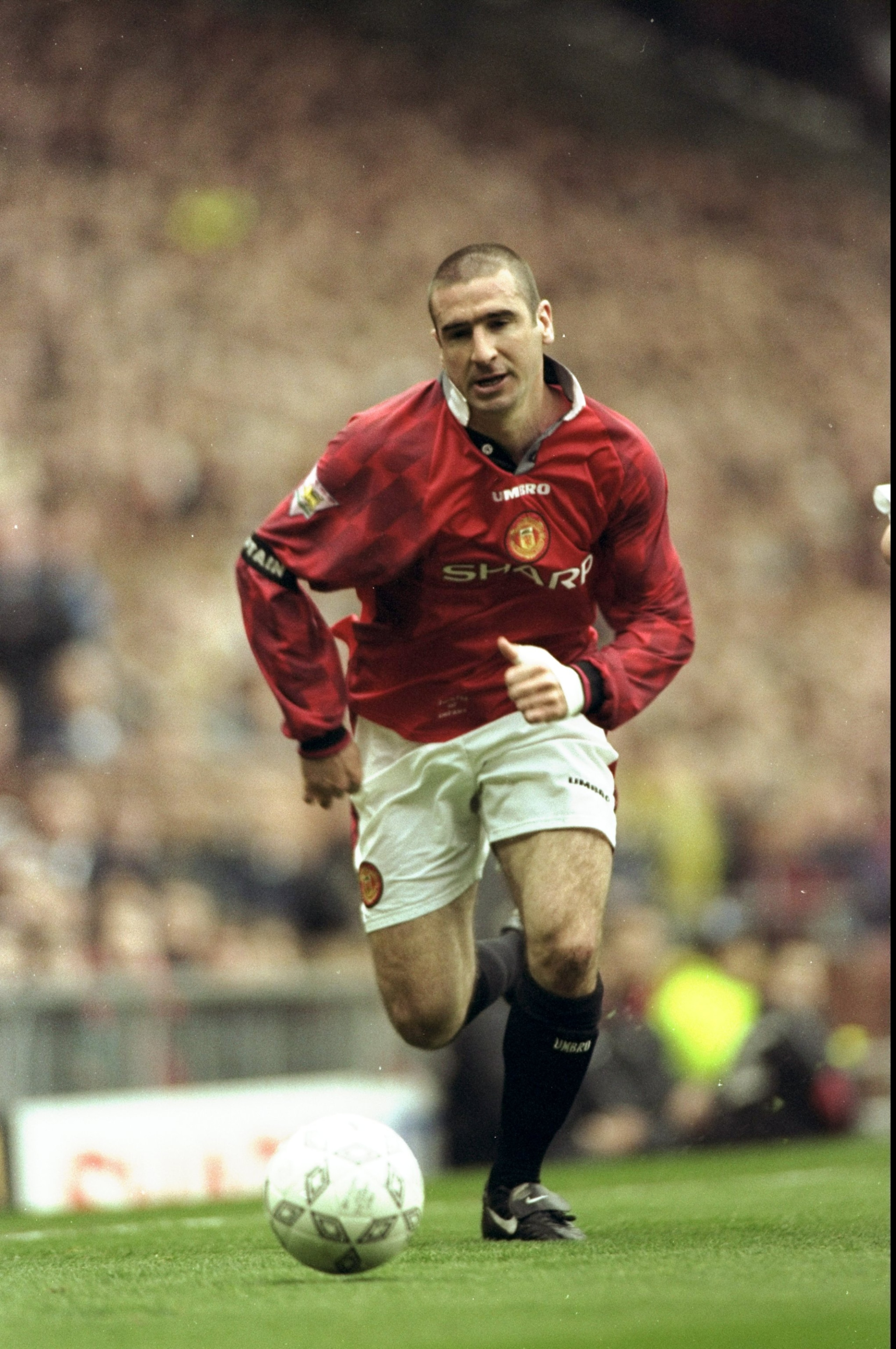5 Apr 1997:  Eric Cantona of Manchester United in action during an FA Carling Premiership match against Derby County at Old Trafford in Manchester, England. Derby County won the match 3-2. \ Mandatory Credit: Shaun  Botterill/Allsport