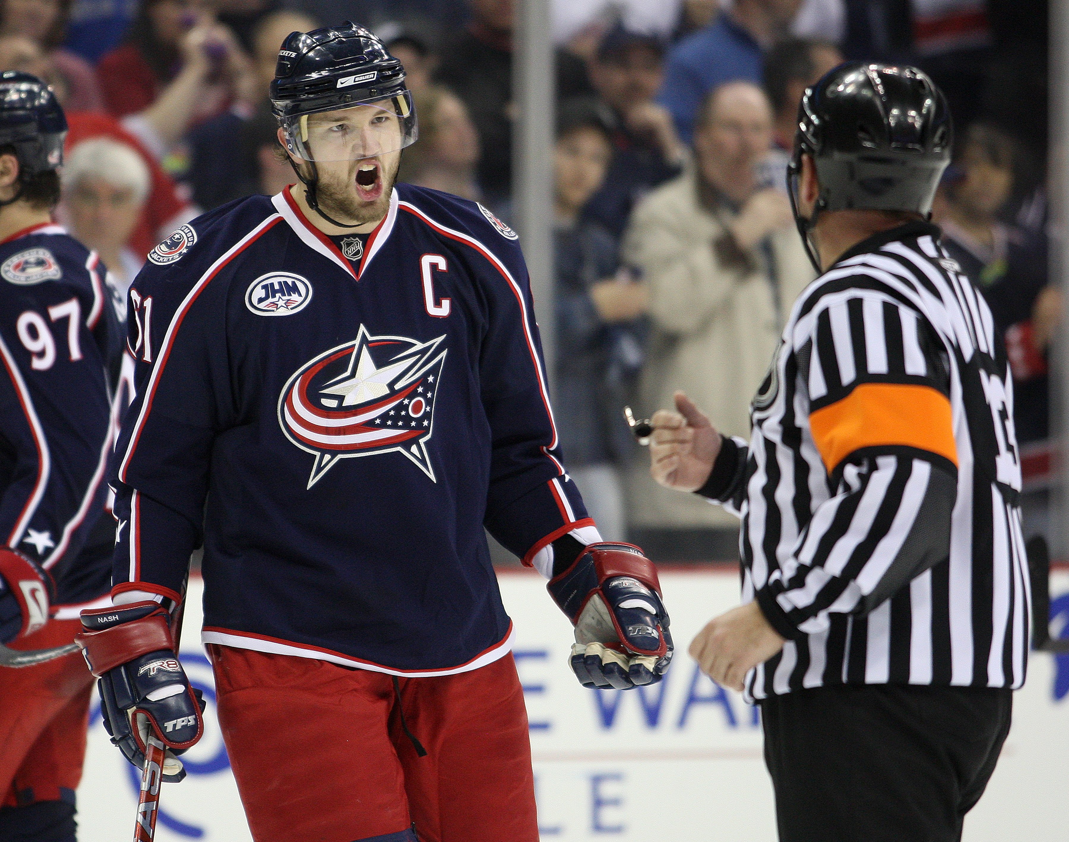COLUMBUS, OHIO - APRIL 23: Rick Nash #61 of the Columbus Blue Jackets questions referee Dan O'Halloran #13 about a late game call against the Detroit Red Wings during Game Four of the Western Conference Quarterfinals of the 2009 Stanley Cup Playoffs on A