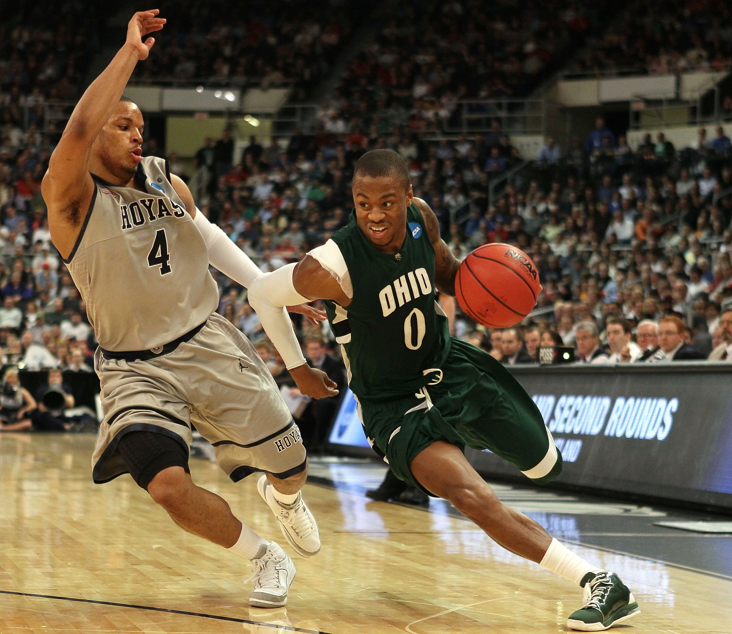 PROVIDENCE, RI - MARCH 18:  Armon Bassett #0 of the Ohio Bobcats drives to the net as Chris Wright #4 of the Georgetown Hoyas defends during the first round of the 2010 NCAA men's basketball tournament on March 18, 2010 at the Dunkin Donuts Arena in Provi