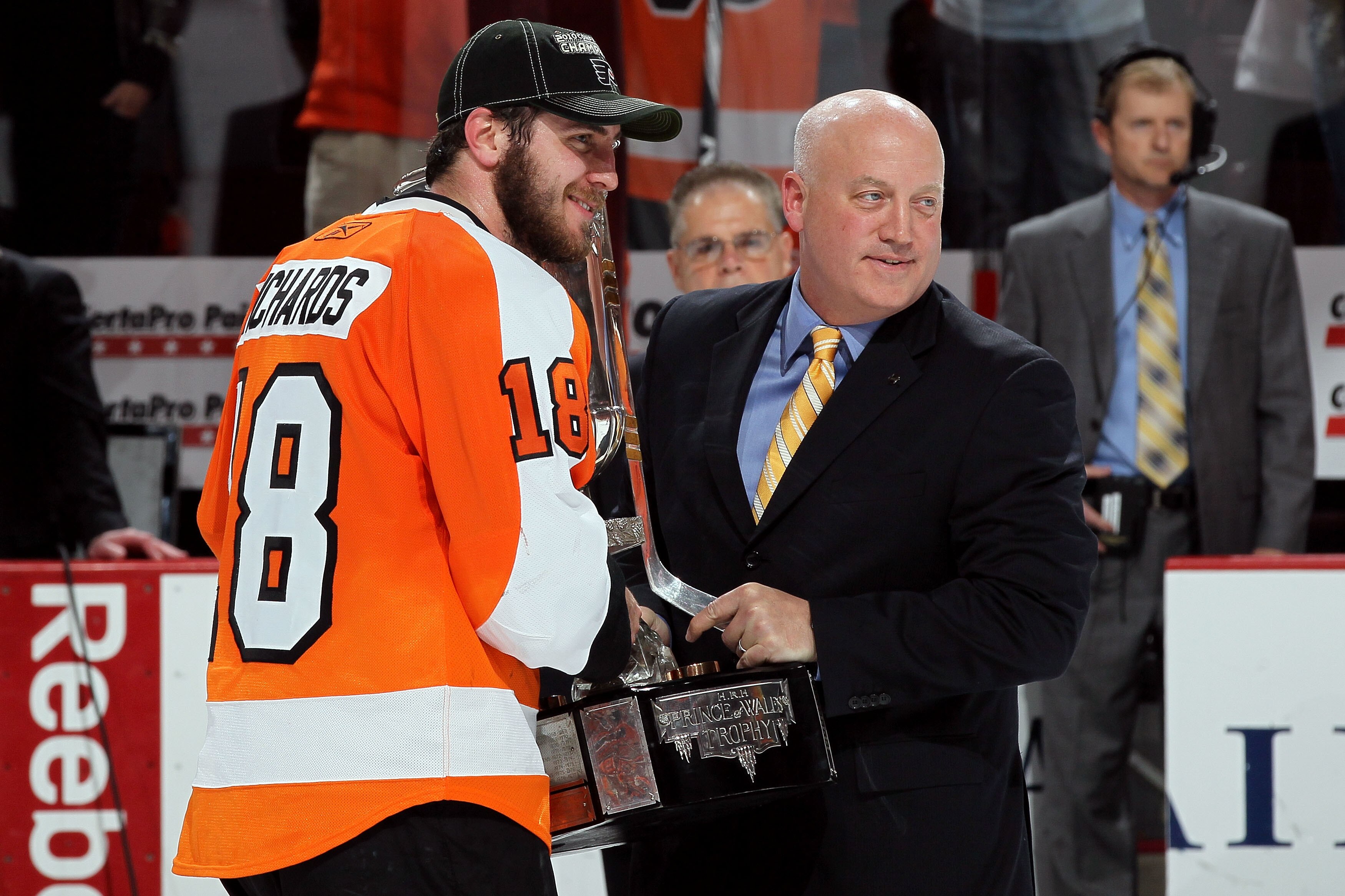 PHILADELPHIA - MAY 24:  Mike Richards #18 of the Philadelphia Flyers recieves the Prince of Wales Trophy for NHL Deputy Commissioner Bill Daly after defeating the Montreal Canadiens by a score of 4-2 to win in Game 5 and advance from the Eastern Conferenc