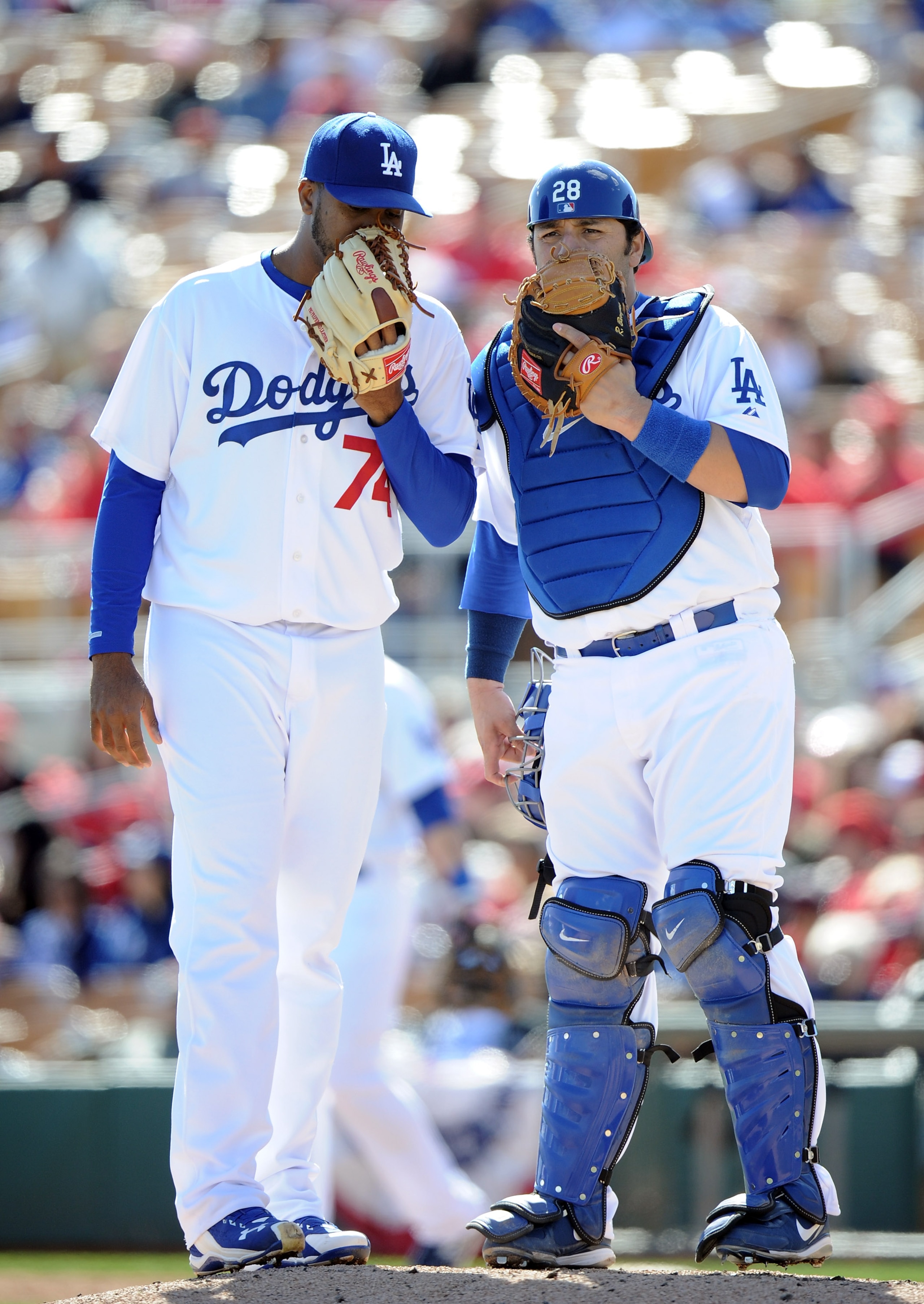 PHOENIX, AZ - FEBRUARY 27:  Kenley Jansen #74 and Rod Barajas #28 of the Los Angeles Dodgers meet on the mound during spring training at Camelback Ranch on February 27, 2011 in Phoenix, Arizona.  (Photo by Harry How/Getty Images)