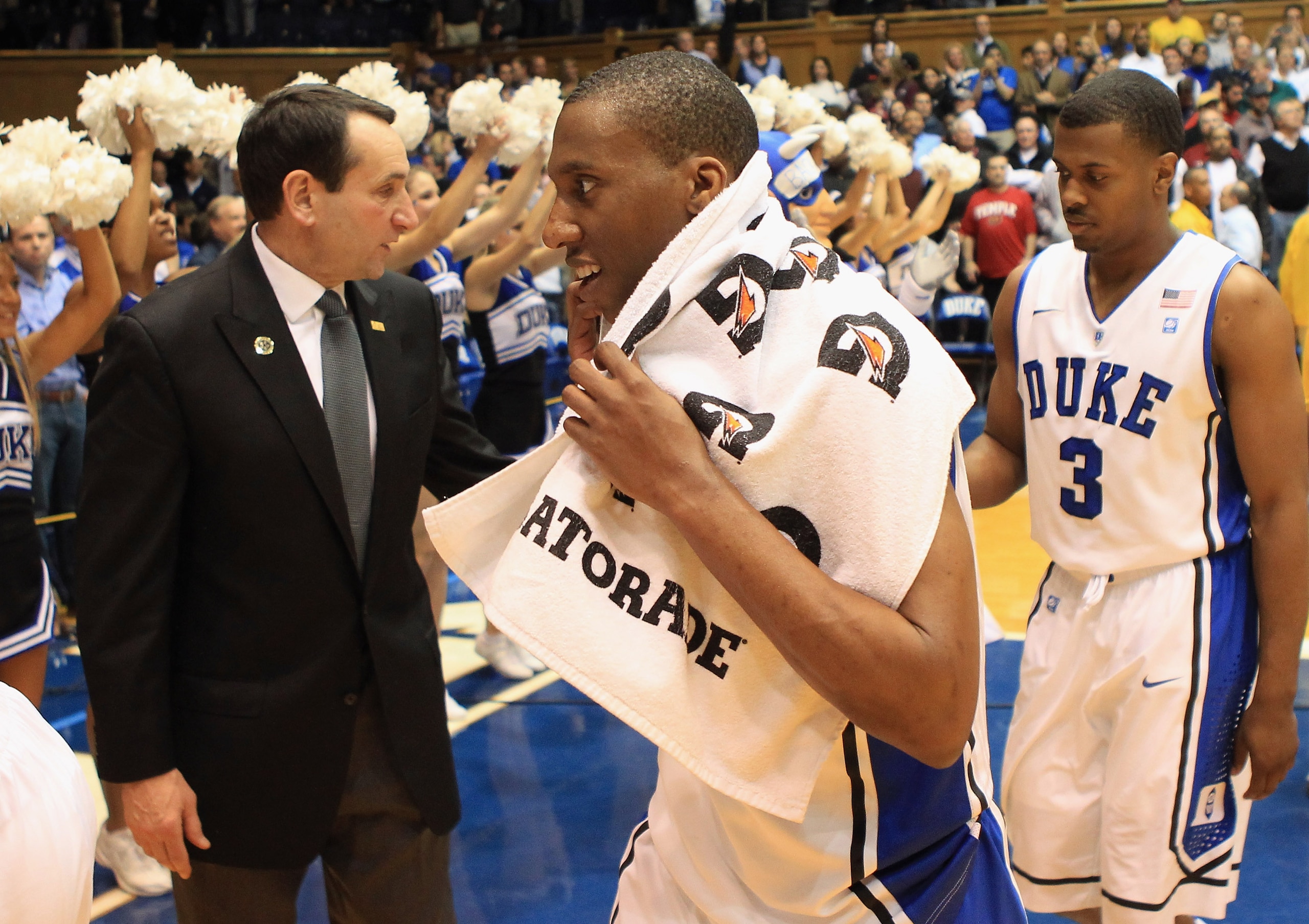DURHAM, NC - FEBRUARY 23: Head coach Mike Krzyzewski congratulates players Nolan Smith #2 and Tyler Thornton #3 of the Duke Blue Devils after their 78-61 victory over the Temple Owls at Cameron Indoor Stadium on February 23, 2011 in Durham, North Carolin DURHAM, NC - FEBRUARY 23: Head coach Mike Krzyzewski congratulates players Nolan Smith #2 and Tyler Thornton #3 of the Duke Blue Devils after their 78-61 victory over the Temple Owls at Cameron Indoor Stadium on February 23, 2011 in Durham, North Carolin