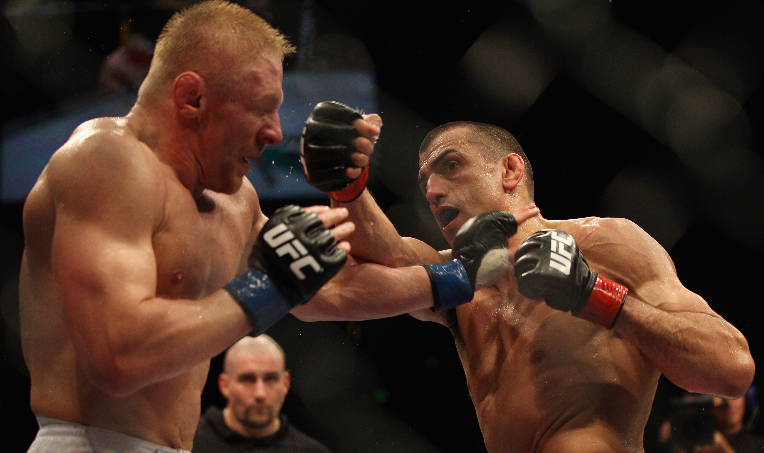 SYDNEY, AUSTRALIA - FEBRUARY 27:  George Sotiropoulos of Australia punches Dennis Silver of Russia during their lightweight bout as part of UFC 127 at Acer Arena on February 27, 2011 in Sydney, Australia.  (Photo by Mark Kolbe/Getty Images)