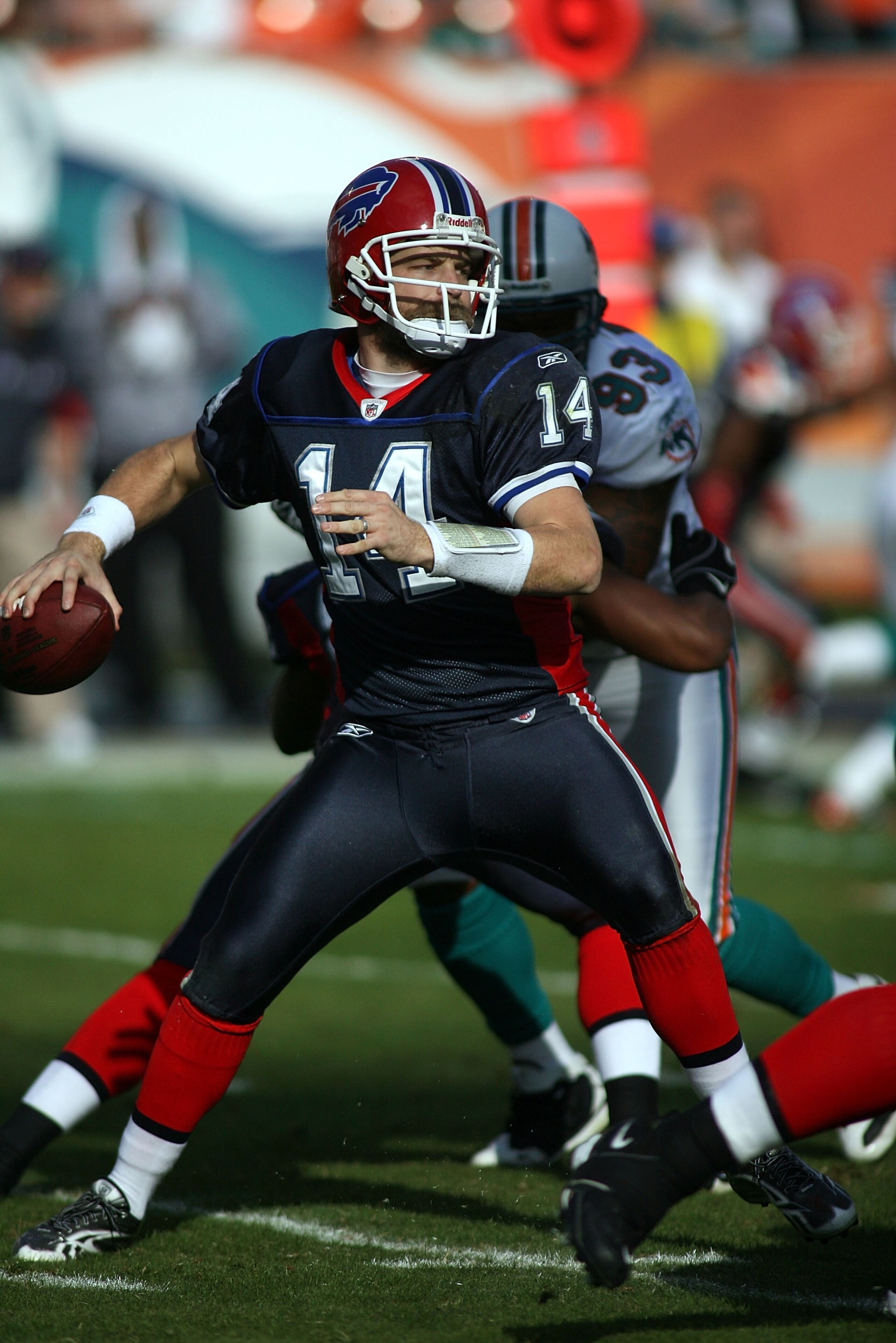 MIAMI - DECEMBER 19:  Quarterback Ryan Fitzpatrick #14 of the Buffalo Bills throws against the Miami Dolphins at Sun Life Stadium on December 19, 2010 in Miami, Florida.The Bills defeated the Dolphins 17-14.  (Photo by Marc Serota/Getty Images)