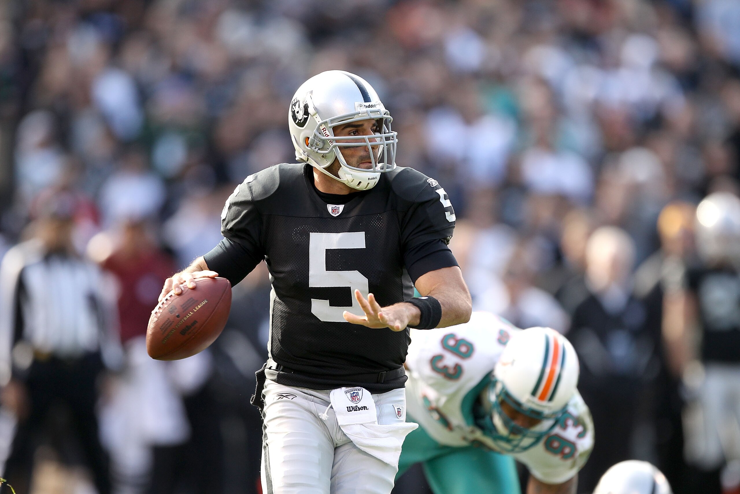 OAKLAND, CA - NOVEMBER 28:  Bruce Gradkowski #5 of the Oakland Raiders in action against the Miami Dolphins at Oakland-Alameda County Coliseum on November 28, 2010 in Oakland, California.  (Photo by Ezra Shaw/Getty Images)