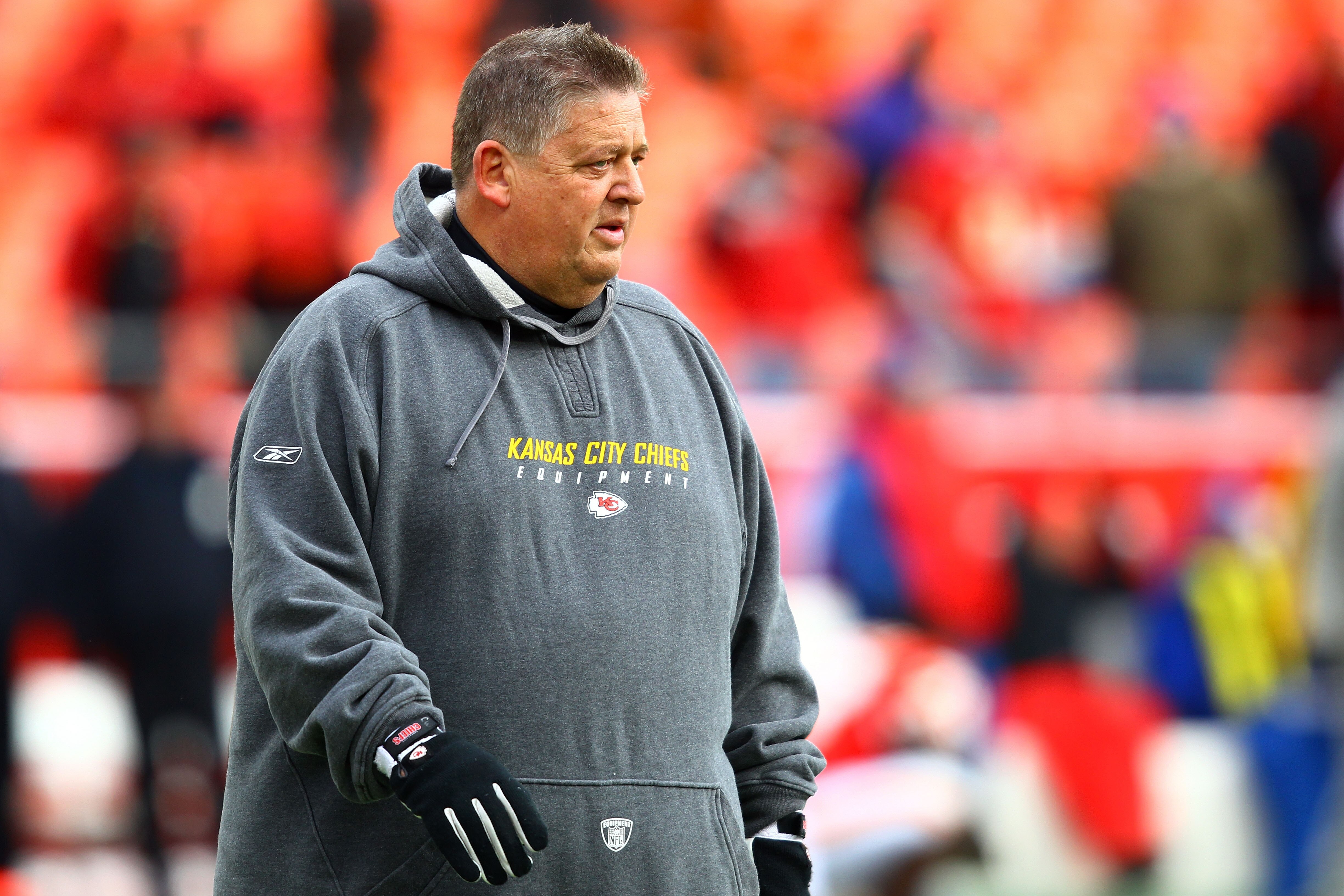 KANSAS CITY, MO - JANUARY 09:  Offensive coordinator Charlie Weis of the Kansas City Chiefs walks in the field prior to playing the Baltimore Ravens in their 2011 AFC wild card playoff game at Arrowhead Stadium on January 9, 2011 in Kansas City, Missouri.