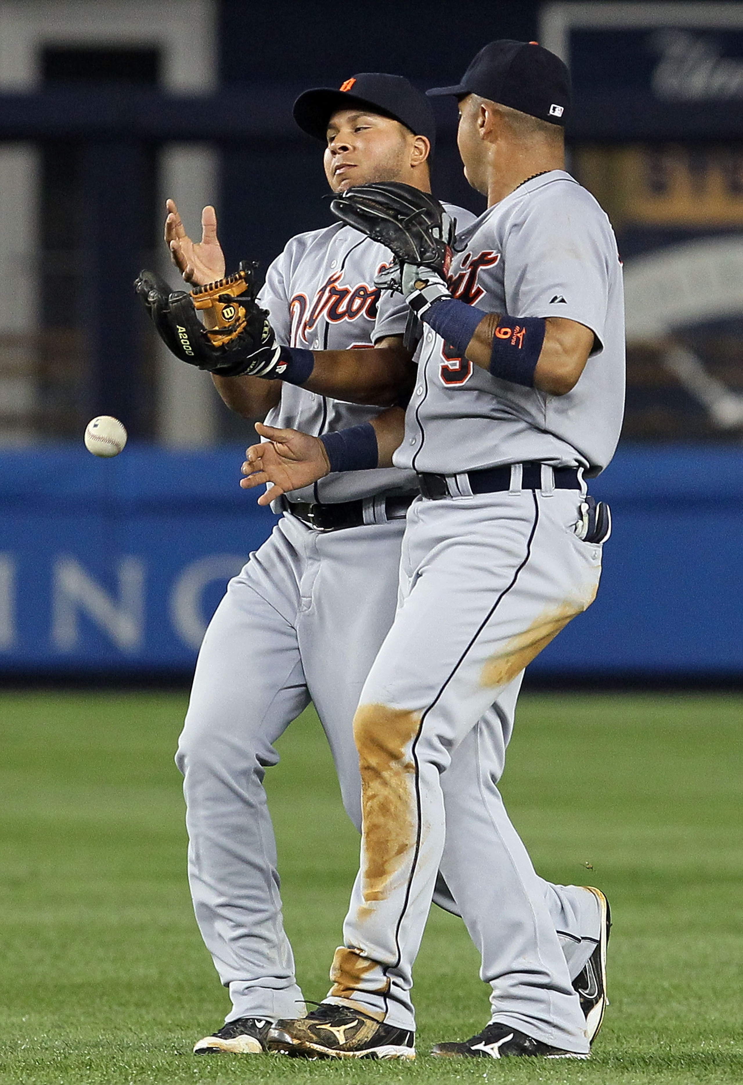NEW YORK - AUGUST 16:  Jhonny Peralta #27 and Carlos Guillen #9 of the Detroit Tigers collide and drop a pop up in the fourth inning against the New York Yankees on August 16, 2010 at Yankee Stadium in the Bronx borough of New York City.  (Photo by Jim Mc