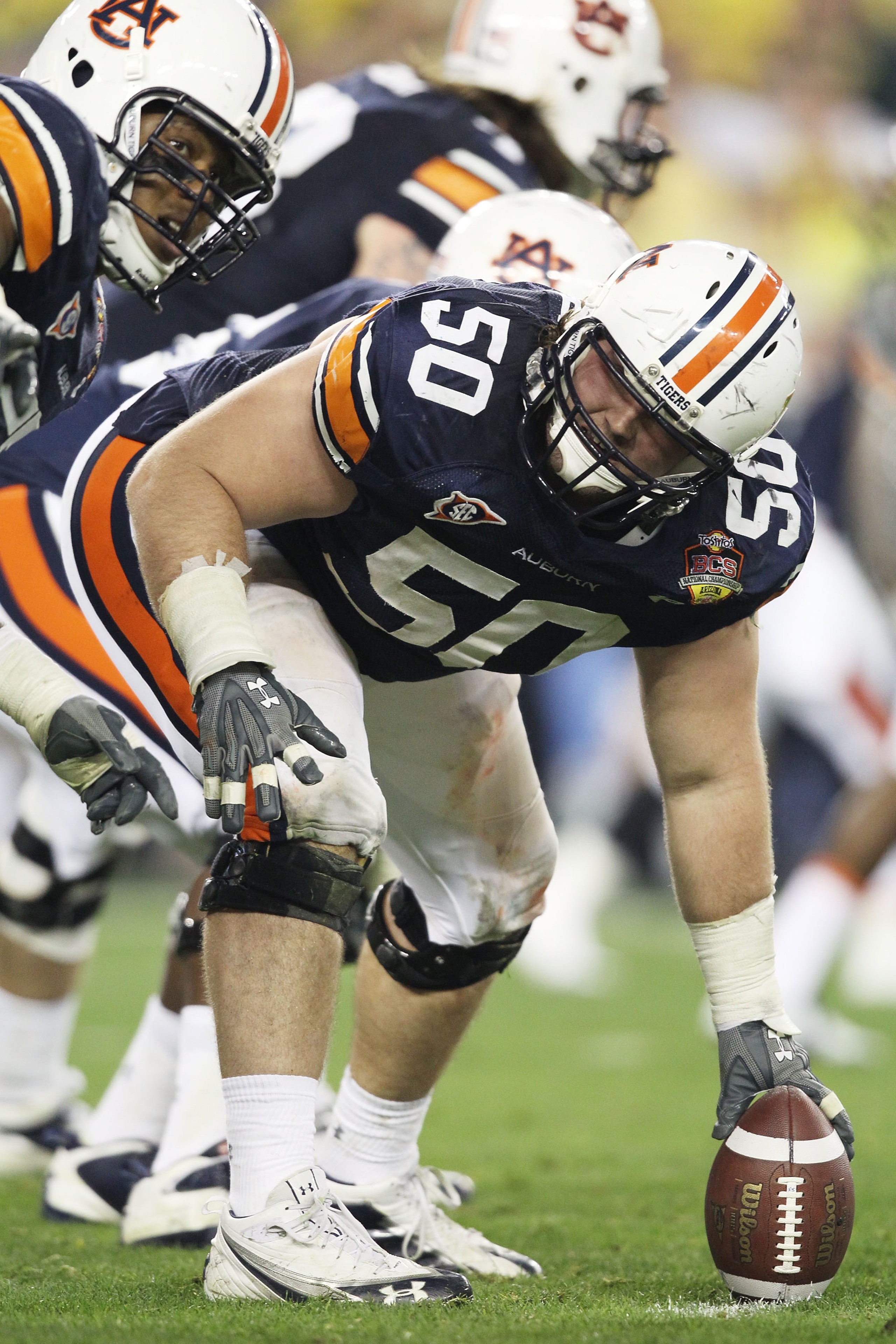 GLENDALE, AZ - JANUARY 10:  Ryan Pugh #50 of the Auburn Tigers prepares to snap the ball against the Oregon Ducks during the Tostitos BCS National Championship Game at University of Phoenix Stadium on January 10, 2011 in Glendale, Arizona.  (Photo by Chri