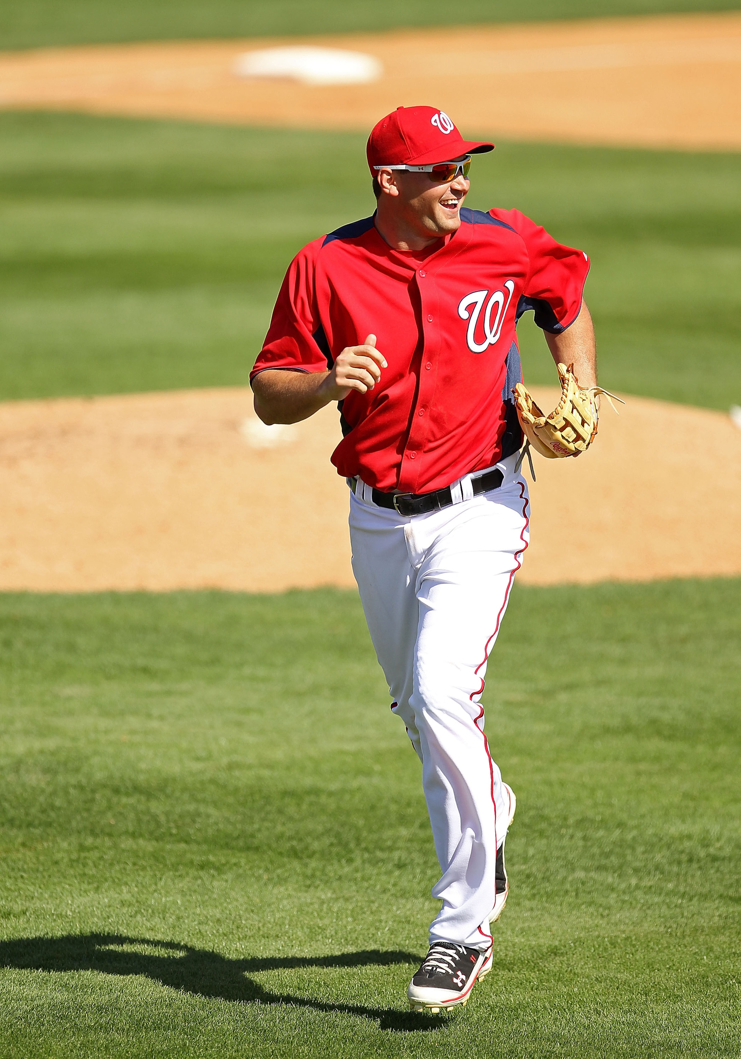VIERA, FL - MARCH 02:  Ryan Zimmerman #11 of the Washington Nationals jogs back to the dugout during a Spring Training game against the Florida Marlinsat Space Coast Stadium on March 2, 2011 in Viera, Florida.  (Photo by Mike Ehrmann/Getty Images)