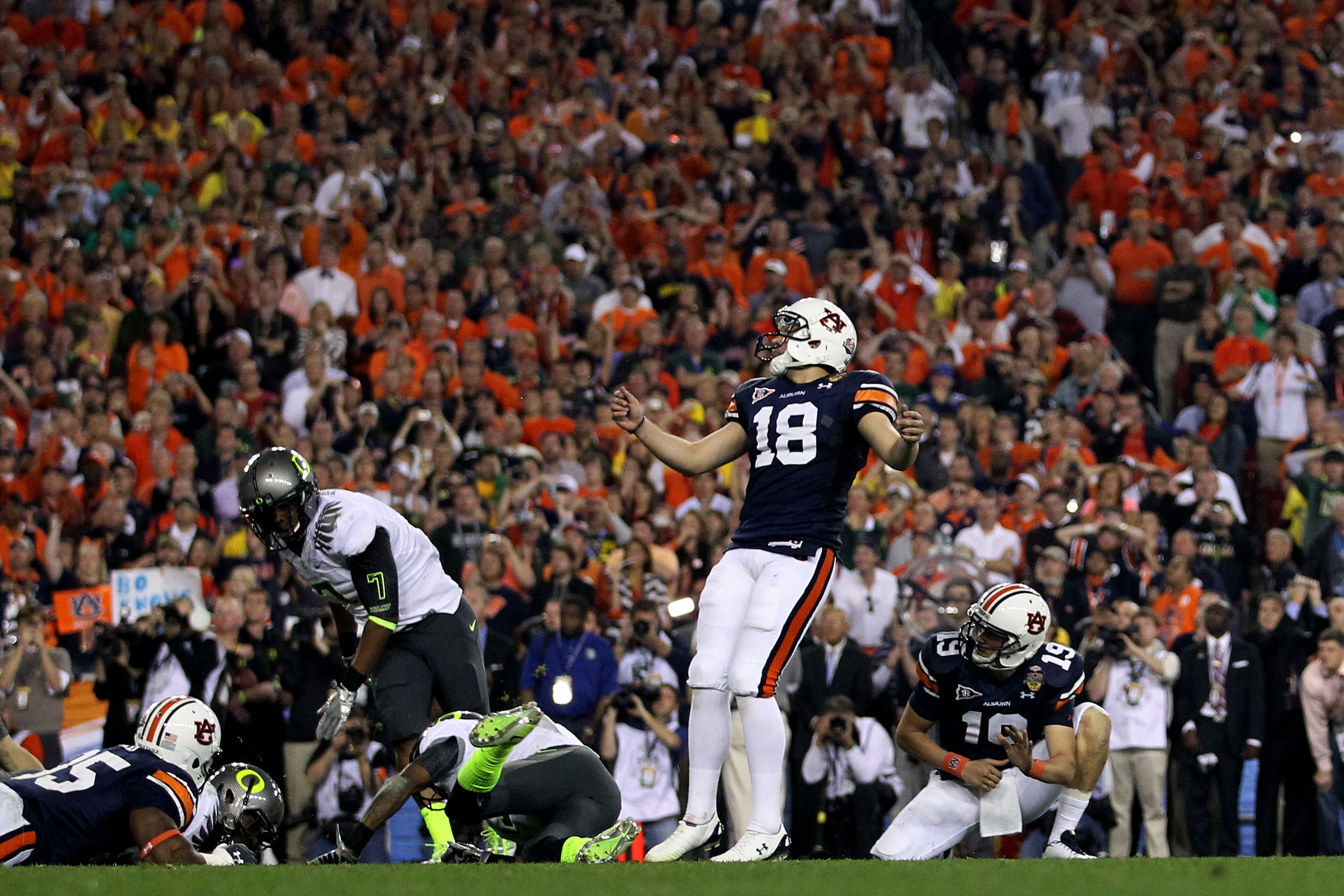 GLENDALE, AZ - JANUARY 10:  Kicker Wes Byrum #18 of the Auburn Tigers kicks a 19-yard game-winning field goal to defeat the Oregon Ducks 22-19 in the Tostitos BCS National Championship Game at University of Phoenix Stadium on January 10, 2011 in Glendale,