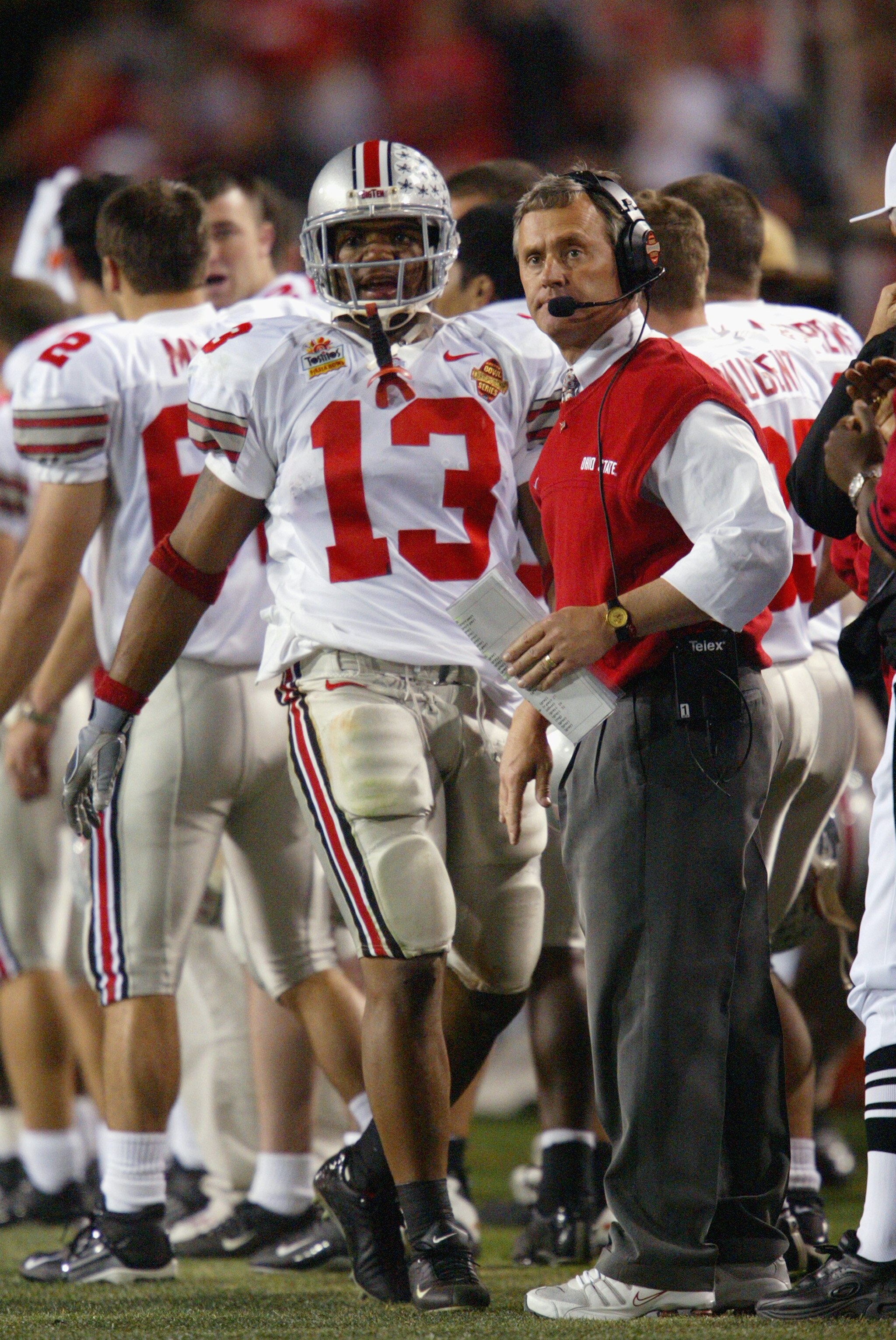 TEMPE, AZ - JANUARY 3:  Head coach Jim Tressel of the Ohio State Buckeyes with running back Maurice Clarett #13 during the Tostitos Fiesta Bowl against the University of Miami Hurricanes at Sun Devil Stadium on January 3, 2003 in Tempe, Arizona.  Ohio Sta