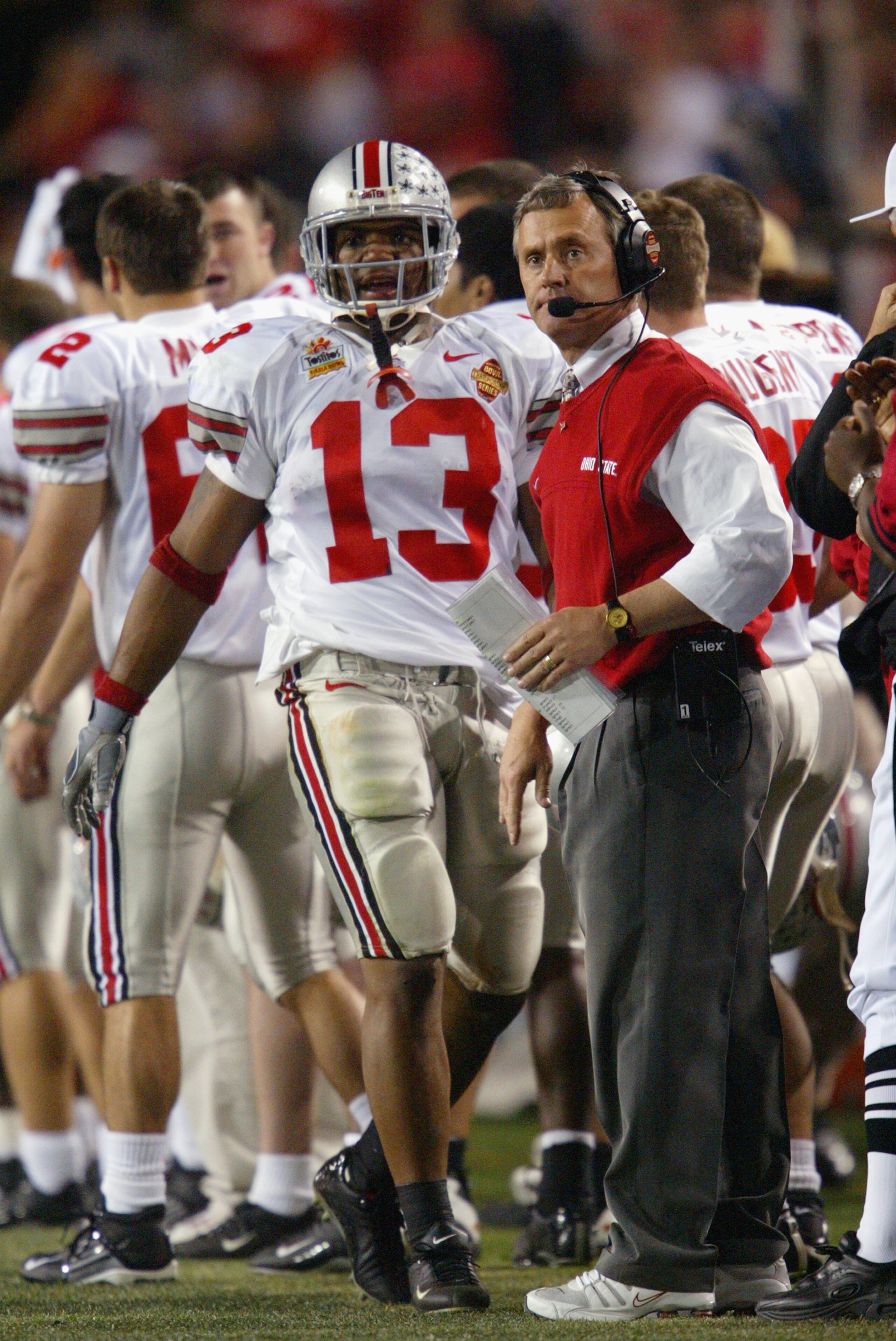 TEMPE, AZ - JANUARY 3:  Head coach Jim Tressel of the Ohio State Buckeyes with running back Maurice Clarett #13 during the Tostitos Fiesta Bowl against the University of Miami Hurricanes at Sun Devil Stadium on January 3, 2003 in Tempe, Arizona.  Ohio Sta