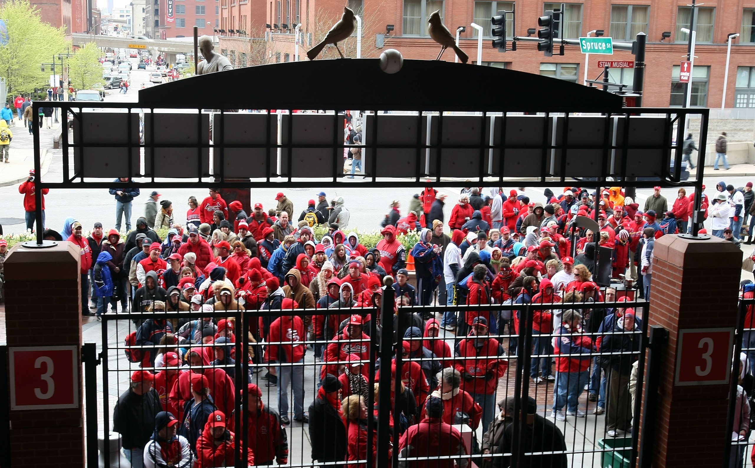 ST. LOUIS - APRIL 06:  Fans wait for the gates to open  for the game between the St. Louis Cardinals and the Pittsburgh Pirates during Opening Day on April 6, 2009  at Busch Stadium in St. Louis, Missouri.  (Photo by Elsa/Getty Images)