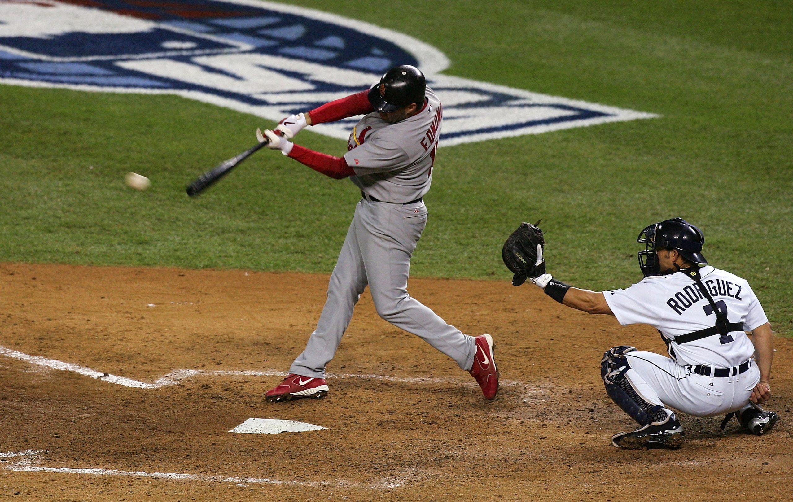 DETROIT - OCTOBER 21:  Jim Edmonds #15 of the St. Louis Cardinals hits an RBI single to score Albert Pujols #5 in the top of the sixth inning against the Detroit Tigers during Game One of 2006 World Series October 21, 2006 at Comerica Park in Detroit Mich