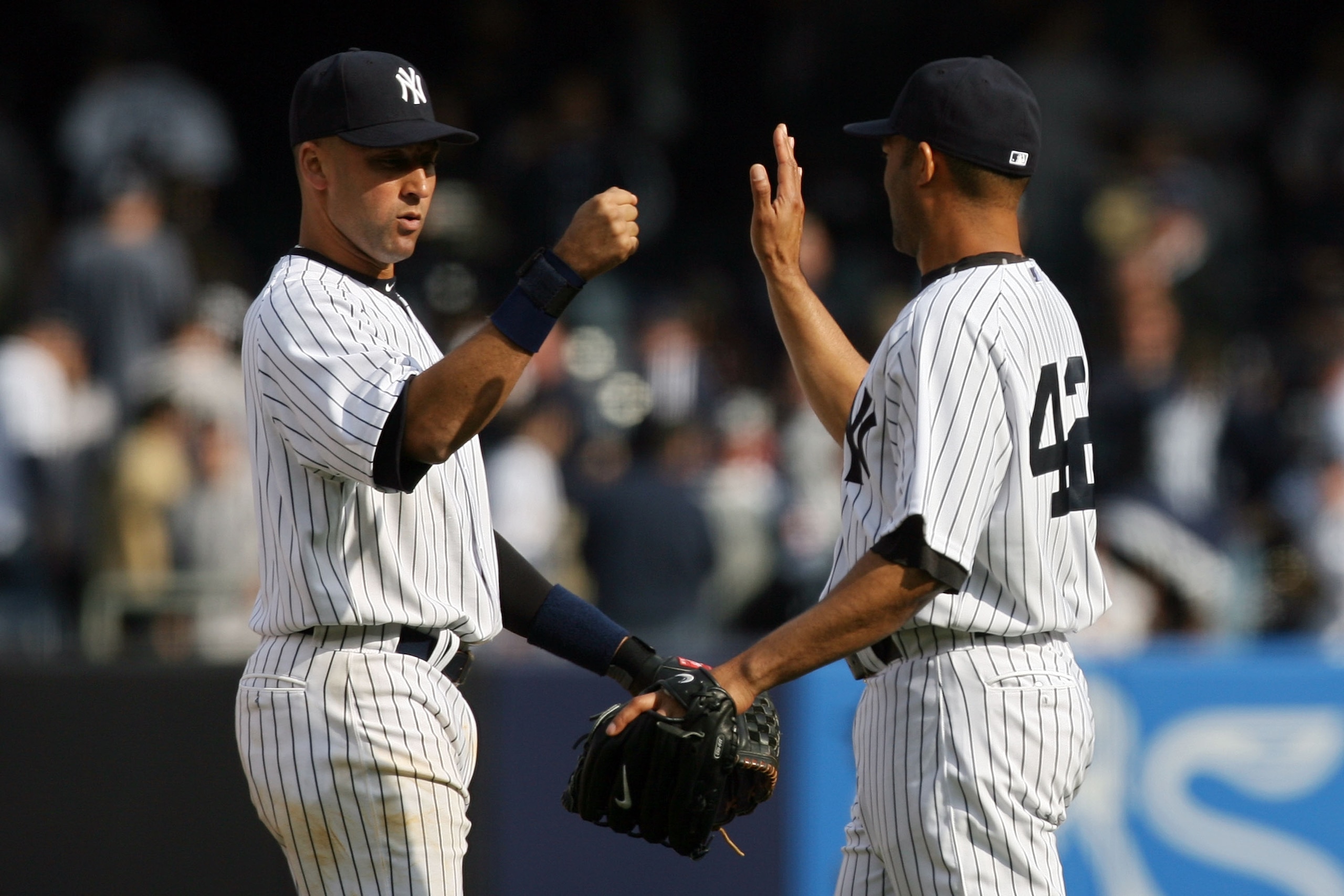 NEW YORK - APRIL 13:  Derek Jeter #2 and Mariano Rivera #42 of the New York Yankees celebrate after defeating the Los Angeles Angels of Anaheim during the Yankees home opener at Yankee Stadium on April 13, 2010 in the Bronx borough of New York City.  (Pho