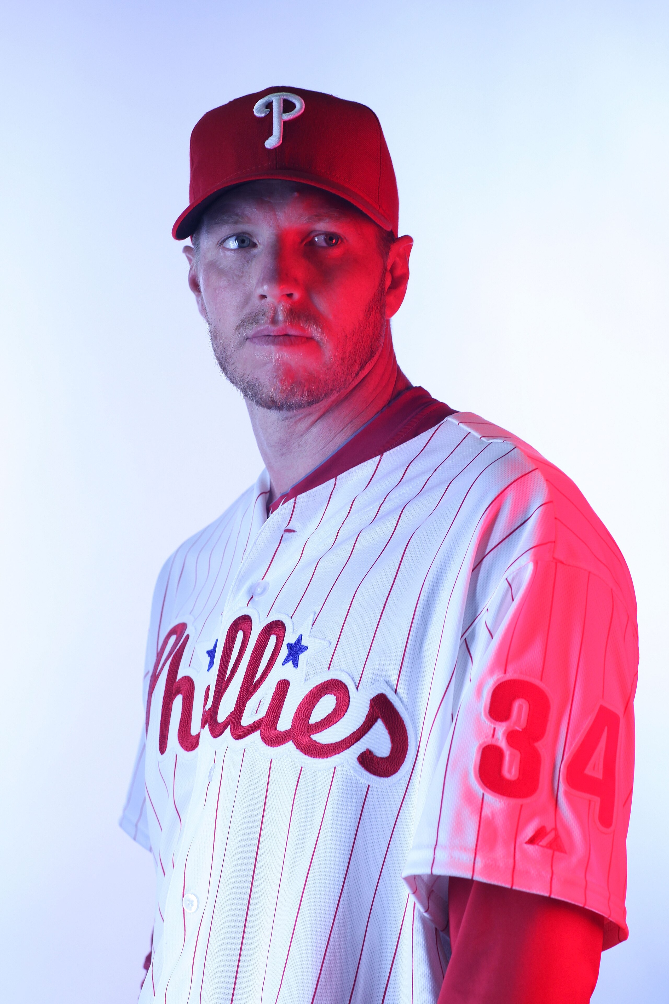 CLEARWATER, FL - FEBRUARY 22:  (EDITORS NOTE: Image was shot with a colored gel on lights) Roy Halladay #34 of the Philadelphia Phillies poses for a photo during Spring Training Media Photo Day at Bright House Networks Field on February 22, 2011 in Clearw