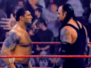 Batista and The Undertaker face off