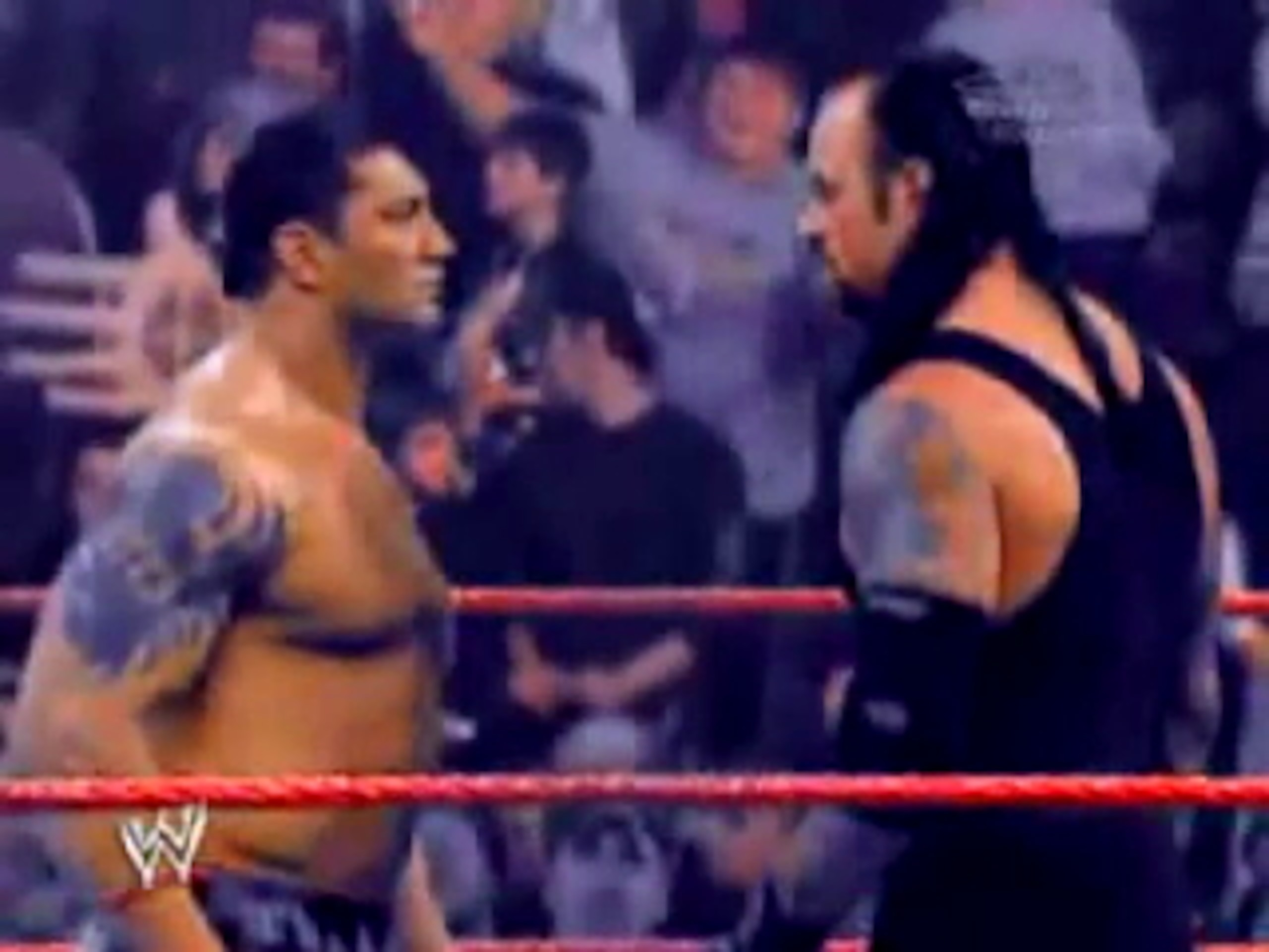 Batista and The Undertaker face off
