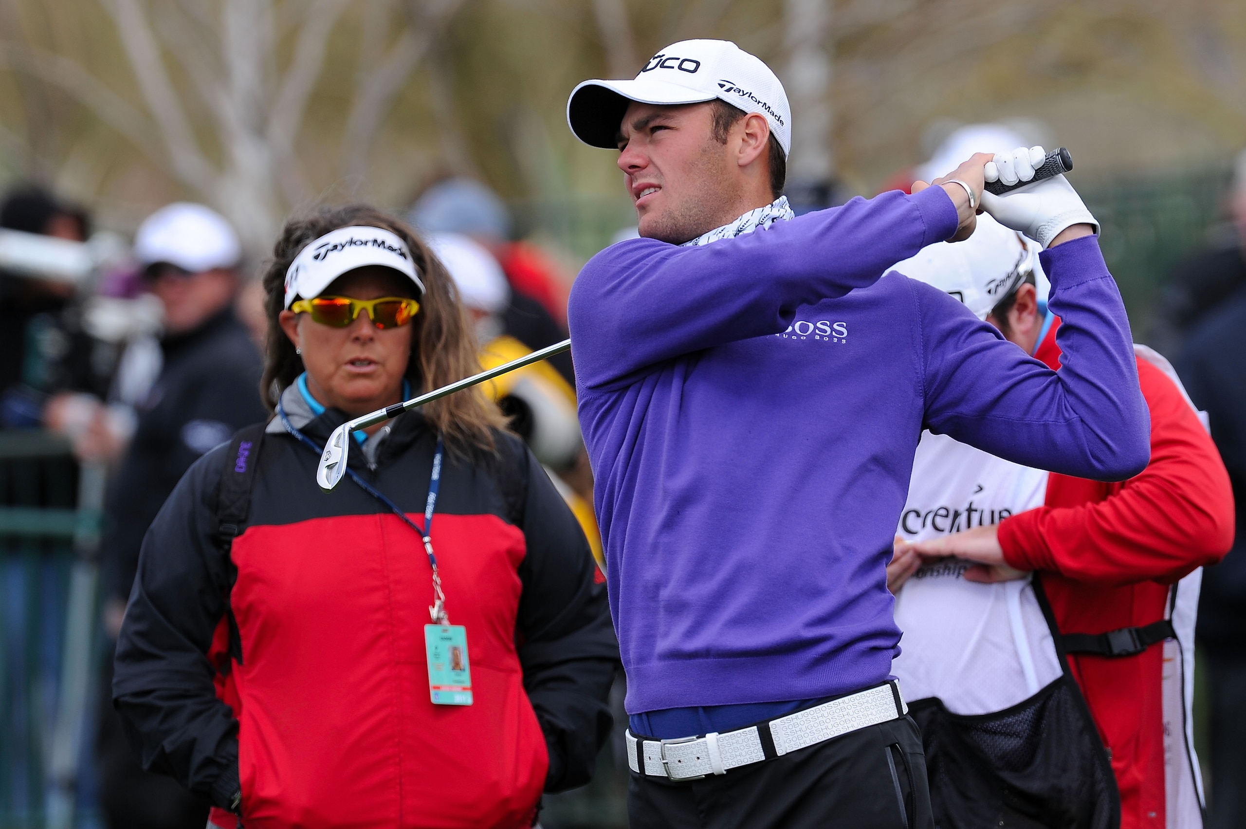 MARANA, AZ - FEBRUARY 27:  Martin  Kaymer of Germany hits a shot on the practice range and Fanny Sunesson looks on prior to the start of the final round of the Accenture Match Play Championship at the Ritz-Carlton Golf Club on February 27, 2011 in Marana,