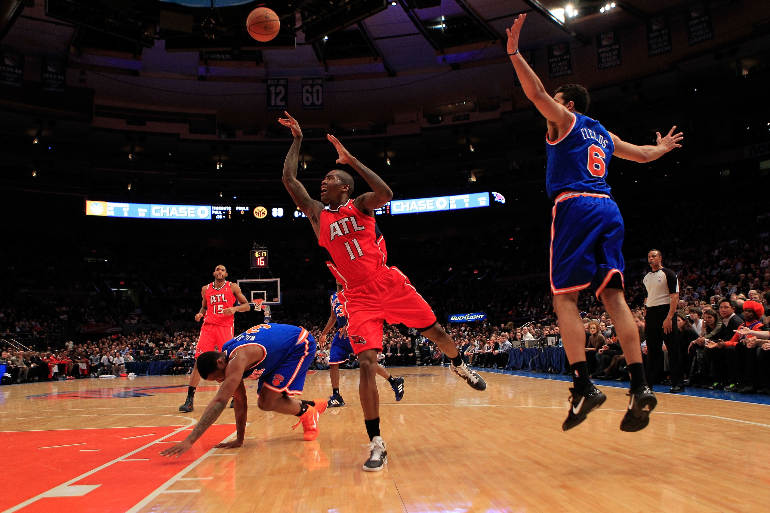 NEW YORK, NY - FEBRUARY 16:  Jamal Crawford #11 of the Atlanta Hawks shoots past Landry Fields #6 of the New York Knicks at Madison Square Garden on February 16, 2011 in New York City. NOTE TO USER: User expressly acknowledges and agrees that, by download