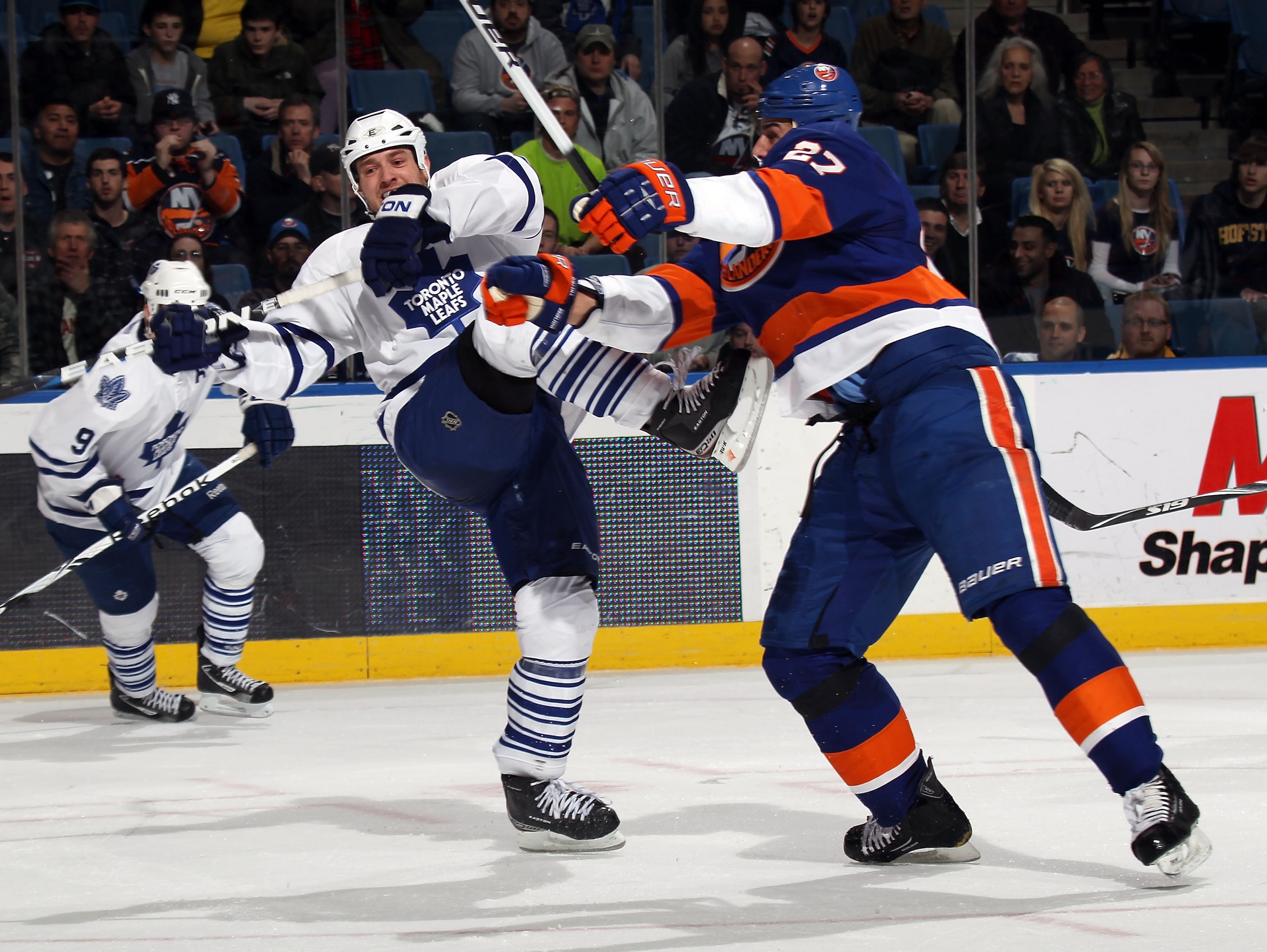 UNIONDALE, NY - MARCH 08: Milan Jurcina #27 of the New York Islanders hits Tim Brent #37 of the Toronto Maple Leafs in the third period at the Nassau Coliseum on March 8, 2011 in Uniondale, New York. The Islanders defeated the Maple Leafs 4-3 in overtime. UNIONDALE, NY - MARCH 08: Milan Jurcina #27 of the New York Islanders hits Tim Brent #37 of the Toronto Maple Leafs in the third period at the Nassau Coliseum on March 8, 2011 in Uniondale, New York. The Islanders defeated the Maple Leafs 4-3 in overtime.