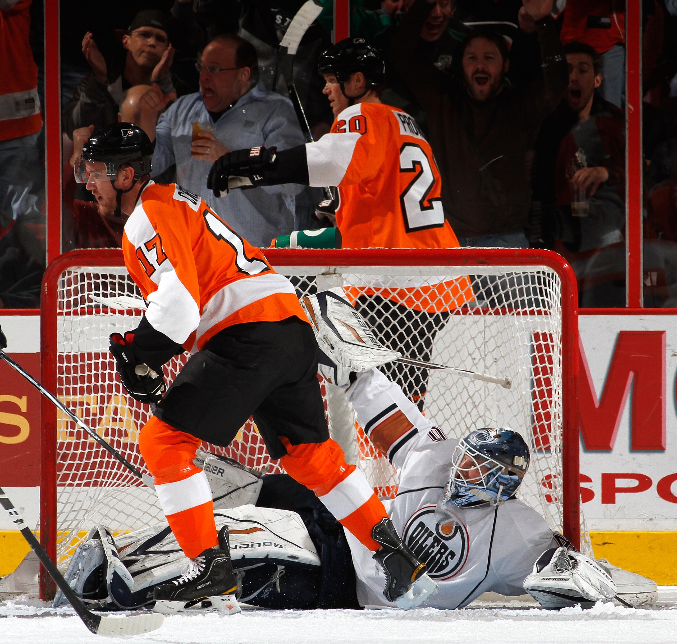 PHILADELPHIA, PA - MARCH 08: Jeff Carter #17 of the Philadelphia Flyers skates away from downed goaltender Devan Dubnyk #40 of the Edmonton Oilers after Carter just scored a goal during the first period of an NHL hockey game while Chris Pronger #20 of th PHILADELPHIA, PA - MARCH 08: Jeff Carter #17 of the Philadelphia Flyers skates away from downed goaltender Devan Dubnyk #40 of the Edmonton Oilers after Carter just scored a goal during the first period of an NHL hockey game while Chris Pronger #20 of th