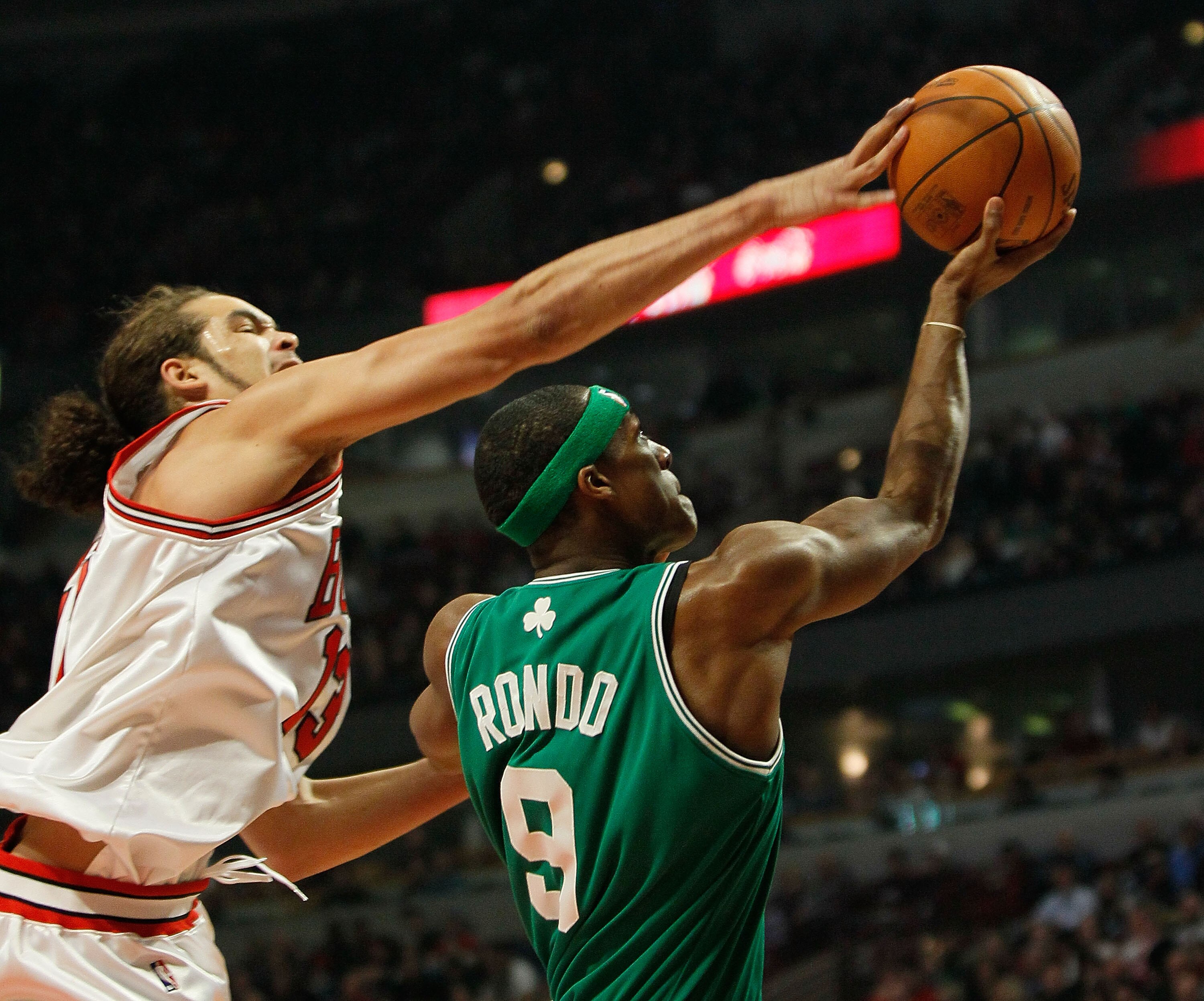 CHICAGO - DECEMBER 12: Joakim Noah #13 of the Chicago Bulls blocks a shot by Rajon Rondo #9 of the Boston Celtics at the United Center on December 12, 2009 in Chicago, Illinois. NOTE TO USER: User expressly acknowledges and agrees that, by downloading and