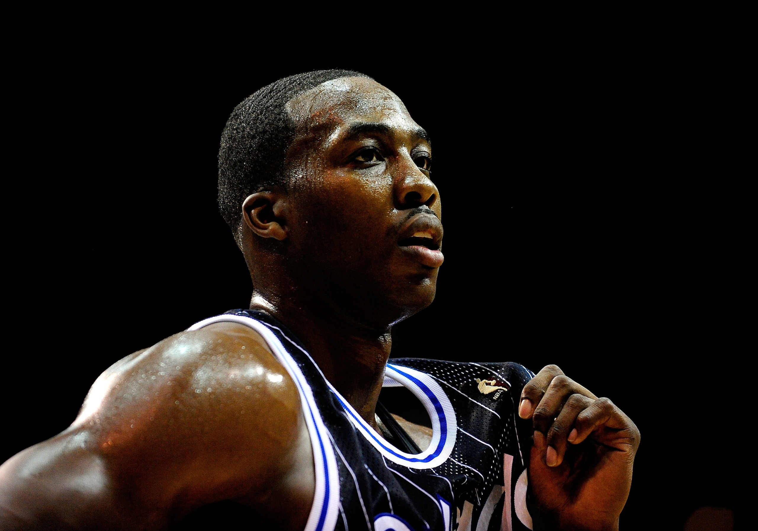 ORLANDO, FL - DECEMBER 02:  Dwight Howard #12 of the Orlando Magic watches the action during the game against the New York Knicks at Amway Arena on December 2, 2009 in Orlando, Florida.  NOTE TO USER: User expressly acknowledges and agrees that, by downlo