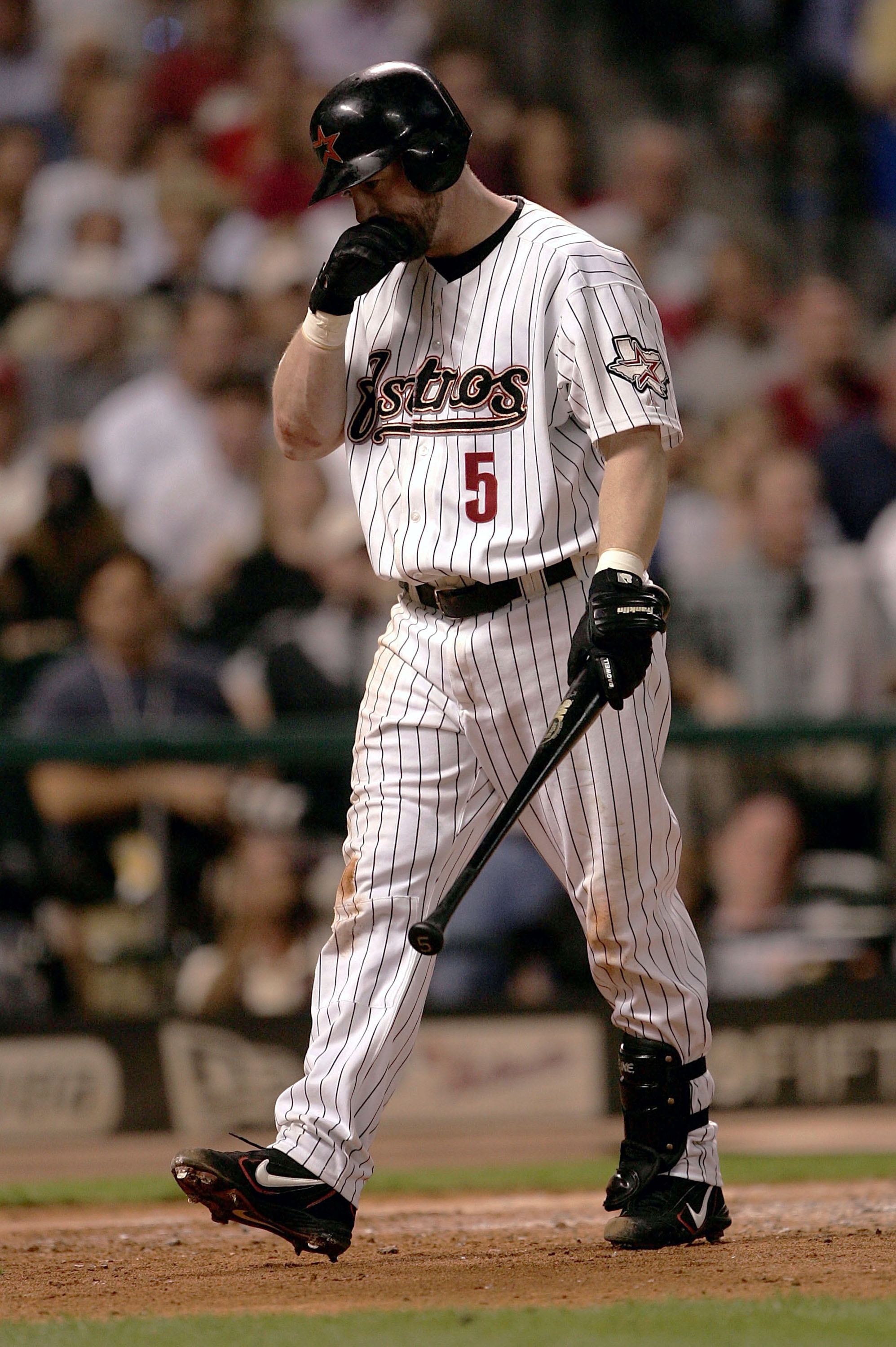 HOUSTON - OCTOBER 18:  Jeff Bagwell #5 of the Houston Astros reacts after striking out in Game 5 of National League Championship Series against the St. Louis Cardinals October 18, 2004 at Minute Maid Park in Houston, Texas.  (Photo By Stephen Dunn/Getty I