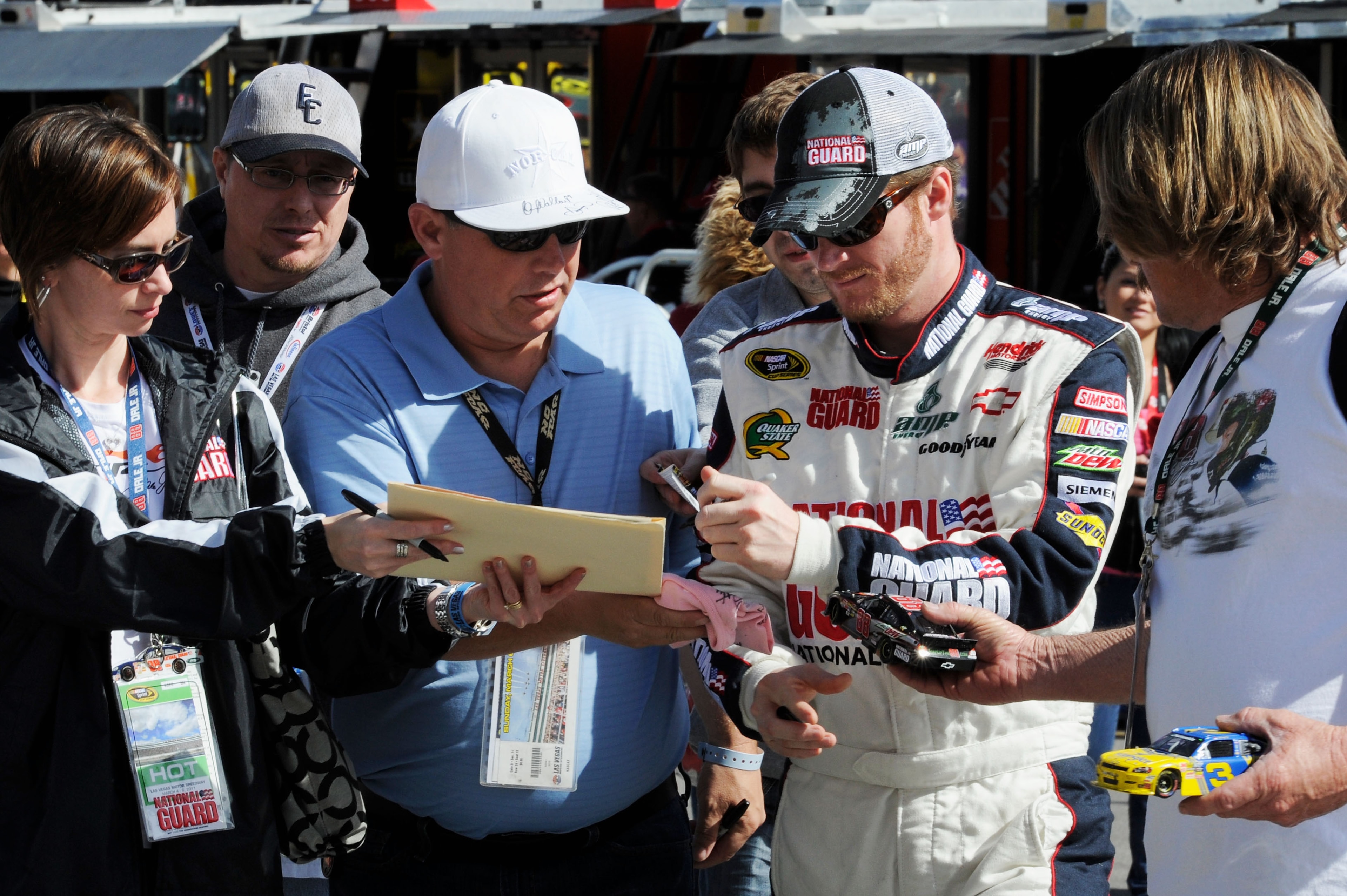 LAS VEGAS, NV - MARCH 05: Dale Earnhardt Jr., driver of the #88 National Guard/Amp Energy Chevrolet, signs his autograph in the garage area during practice for the NASCAR Sprint Cup Series Kobalt Tools 400 at Las Vegas Motor Speedway on March 5, 2011 in LAS VEGAS, NV - MARCH 05: Dale Earnhardt Jr., driver of the #88 National Guard/Amp Energy Chevrolet, signs his autograph in the garage area during practice for the NASCAR Sprint Cup Series Kobalt Tools 400 at Las Vegas Motor Speedway on March 5, 2011 in