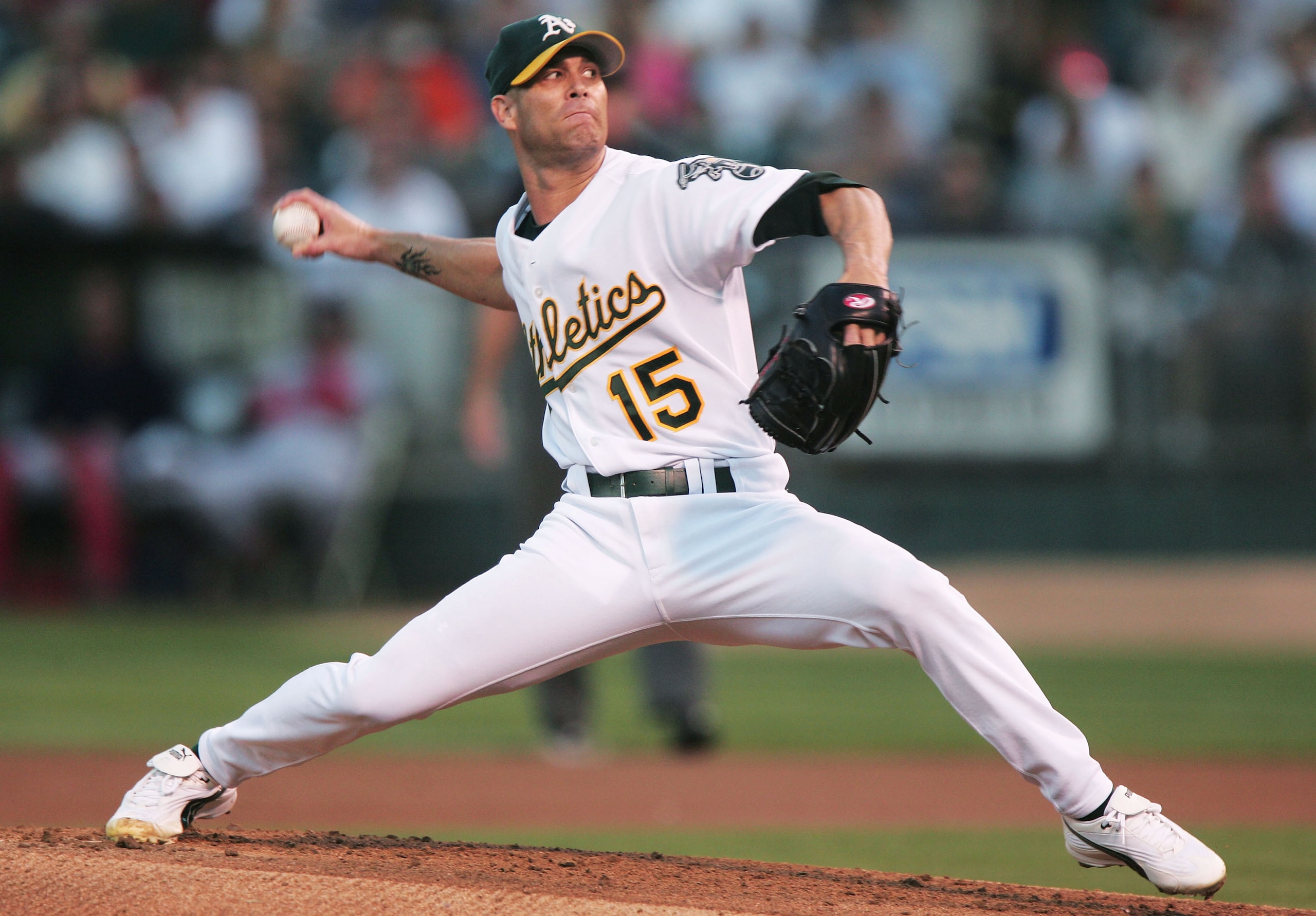 OAKLAND, CA - SEPTEMBER 7: Tim Hudson #15 of the Oakland Athletics delivers a pitch against the Boston Red Sox during a MLB game at the Network Associates Coliseum on September 7, 2004 in Oakland, California. (Photo by Jed Jacobsohn/Getty Images)