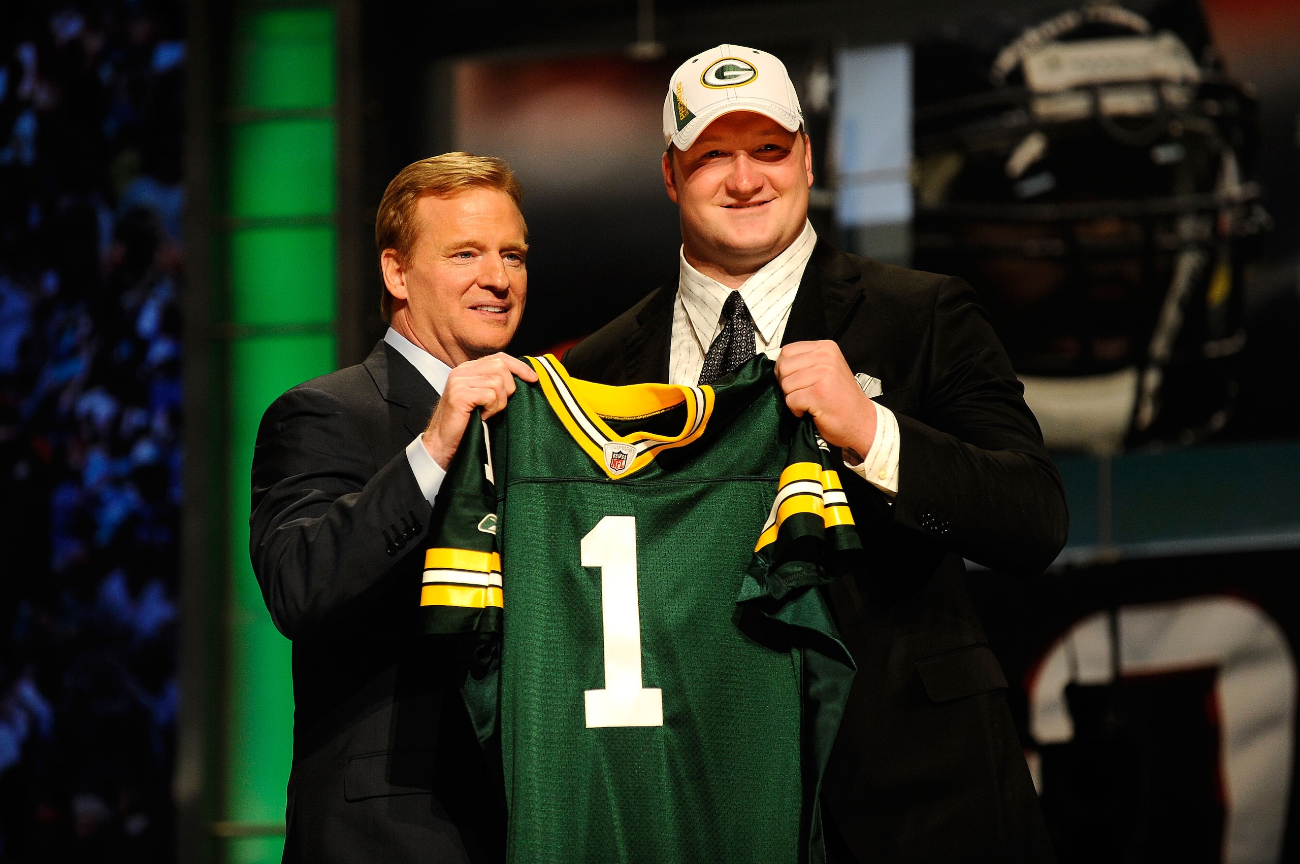 NEW YORK - APRIL 22:  Bryan Bulaga from the Iowa Hawkeyes poses with NFL Commissioner ROger Goodell as they hold up a Green Bay Packers jersey after the Packers drafted Bulaga number 23 overall during the first round of the 2010 NFL Draft at Radio City Mu