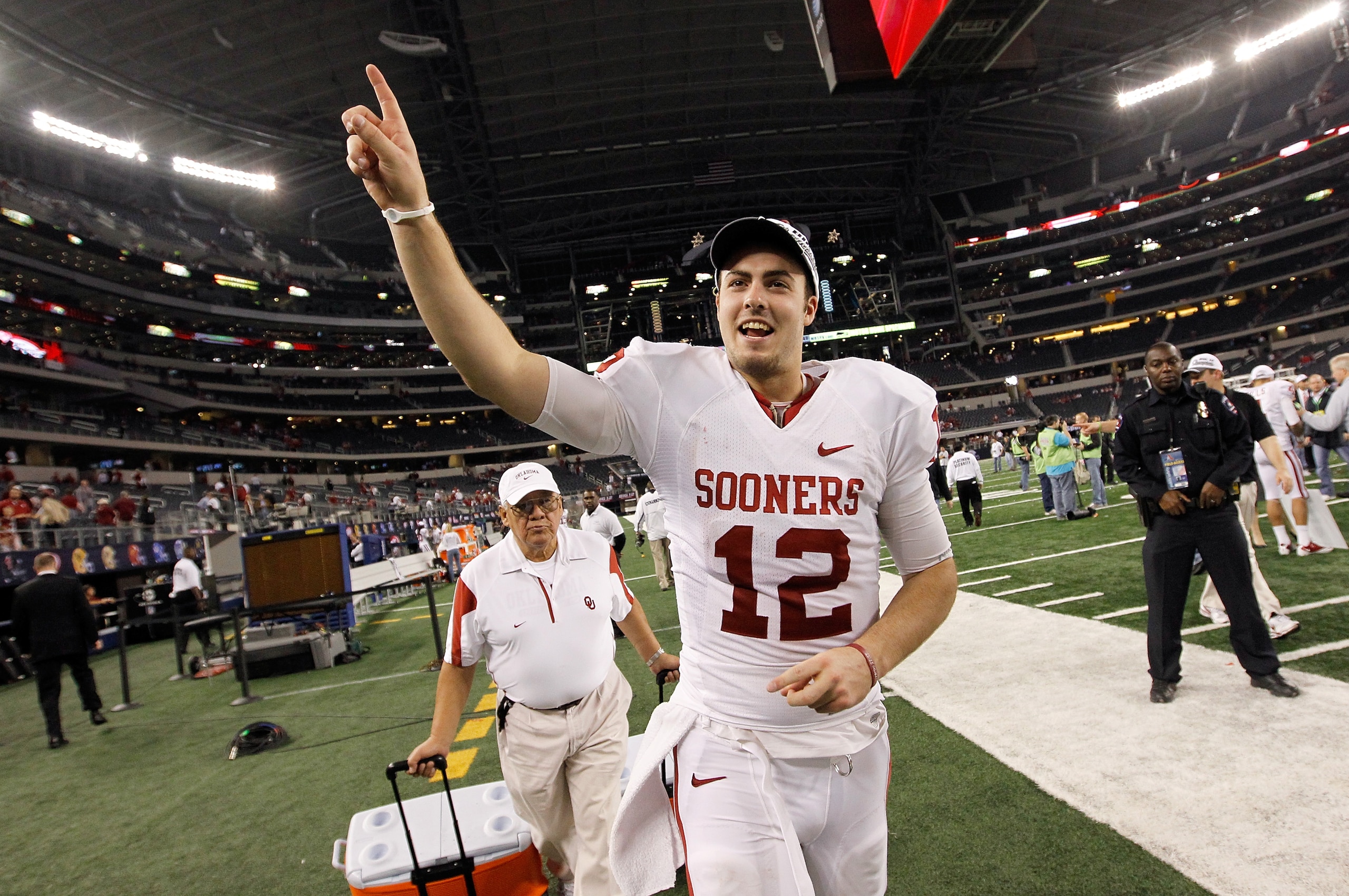 ARLINGTON, TX - DECEMBER 04:  Quarterback Landry Jones #12 of the Oklahoma Sooners celebrates after the Sooners beat the Nebraska Cornhuskers 23-20 at Cowboys Stadium on December 4, 2010 in Arlington, Texas.  (Photo by Tom Pennington/Getty Images)