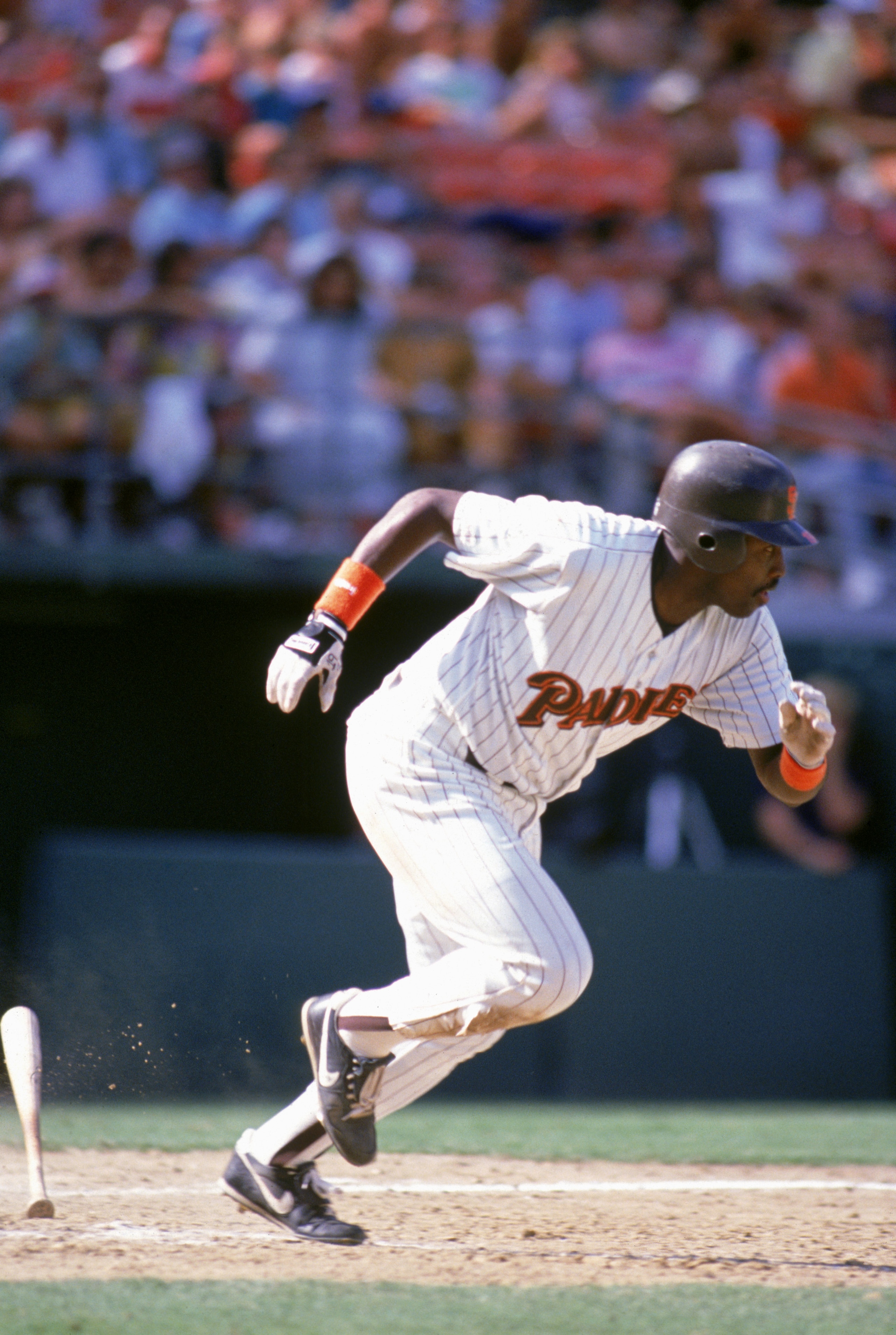 SAN DIEGO - 1990:  Tony Gwynn #19 of the San Diego Padres runs to first base during a 1990 game at Jack Murphy Stadium in San Diego, California. (Photo by Stephen Dunn/Getty Images)