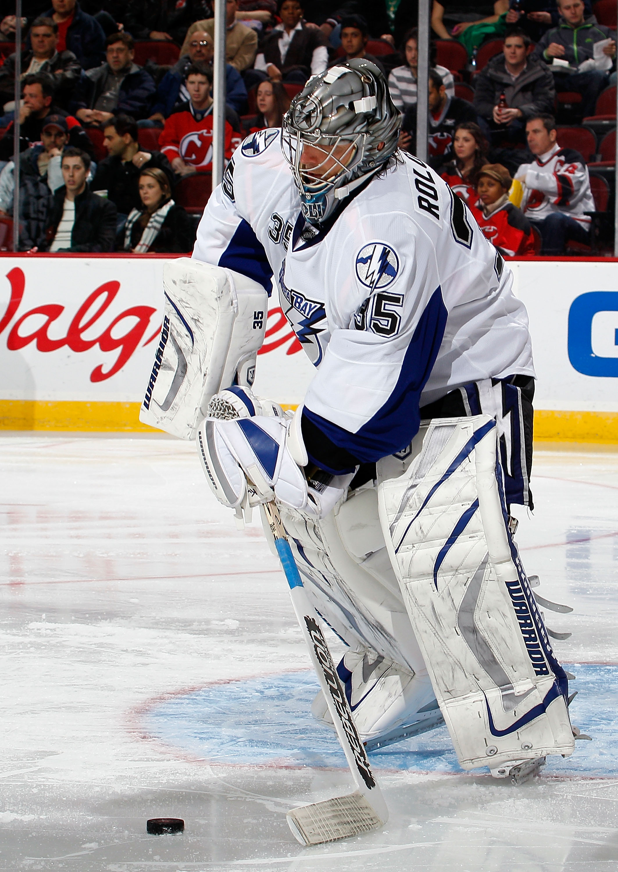 NEWARK, NJ - MARCH 02: Goalie Dwayne Roloson #35 of the Tampa Bay Lightning clears the puck during an NHL hockey game against the New Jersey Devils at the Prudential Center on March 2, 2011 in Newark, New Jersey. (Photo by Paul Bereswill/Getty Images)
