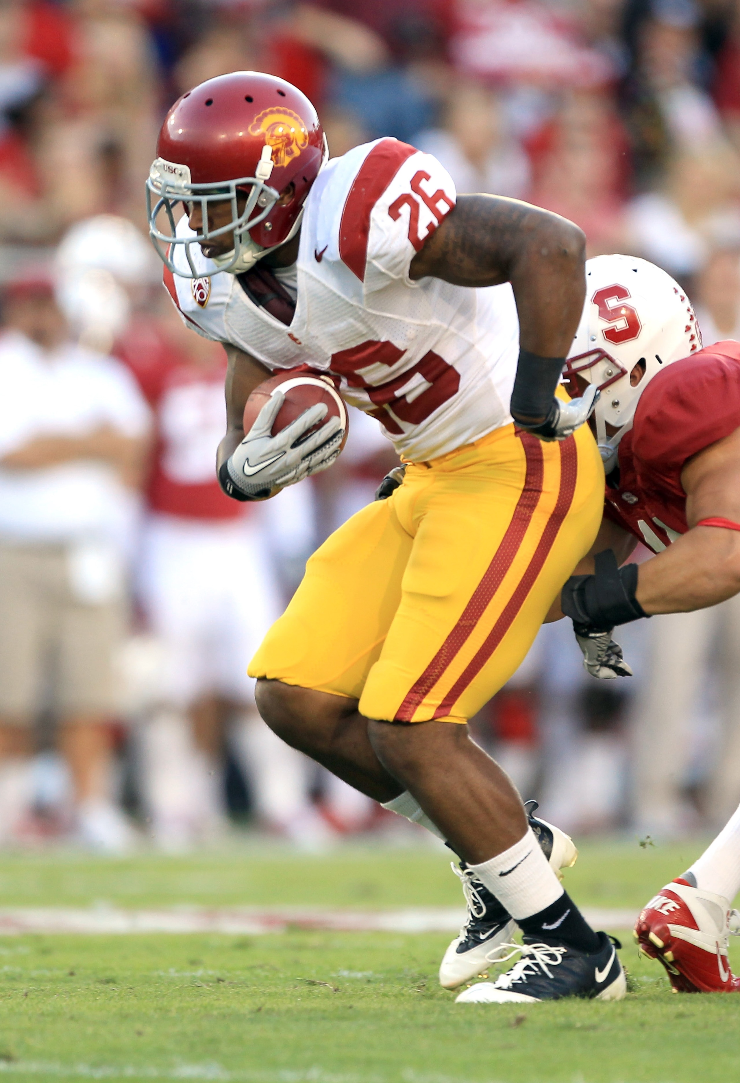 PALO ALTO, CA - OCTOBER 09:  Marc Tyler #26 of the USC Trojans runs with the ball during their game against the Stanford Cardinal at Stanford Stadium on October 9, 2010 in Palo Alto, California.  (Photo by Ezra Shaw/Getty Images)