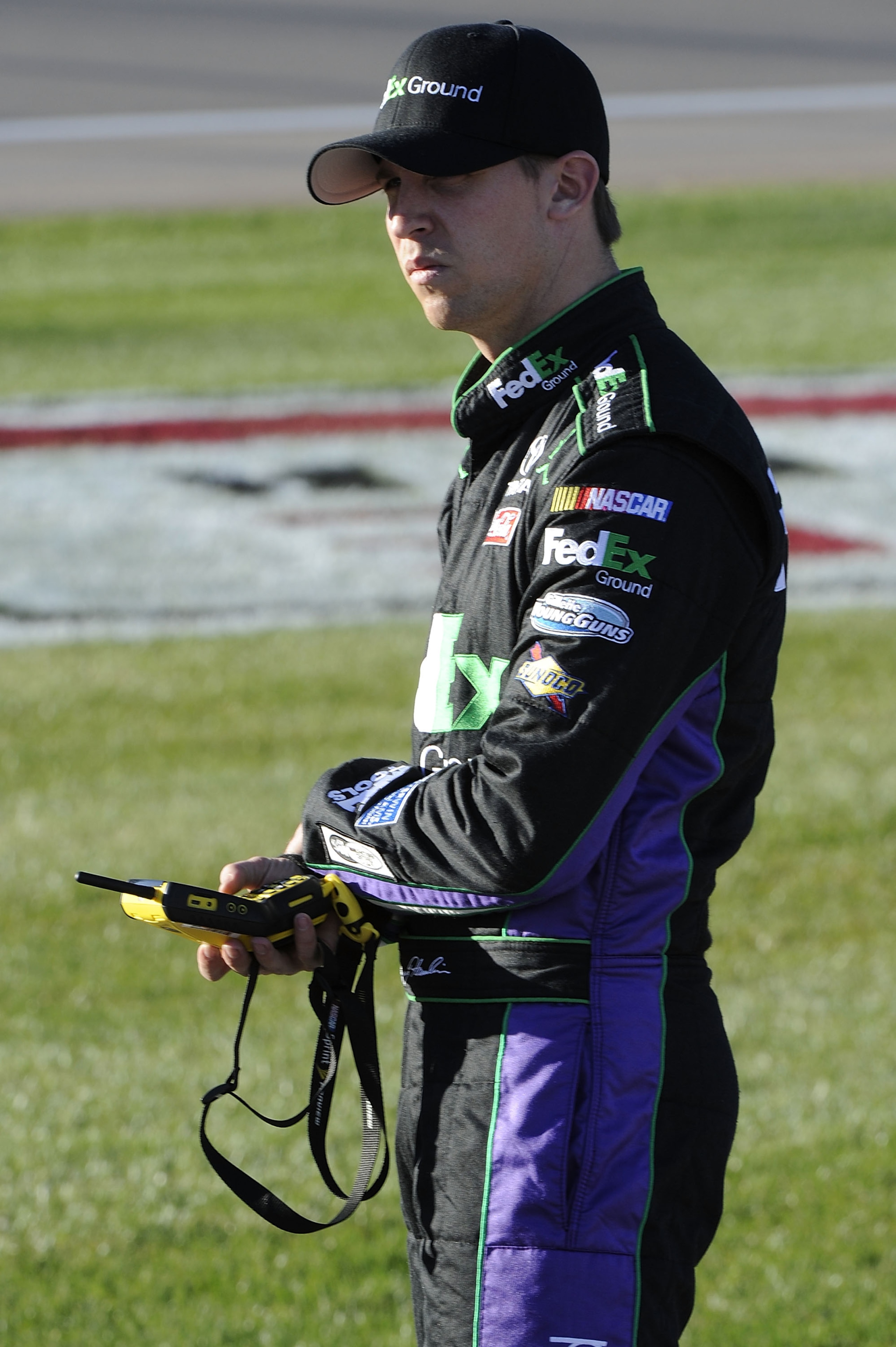 LAS VEGAS, NV - MARCH 04:  Denny Hamlin, driver of the #11 FedEx Ground Toyota, waits on the grid during qualifying for the NASCAR Sprint Cup Series Kobalt Tools 400 at Las Vegas Motor Speedway on March 4, 2011 in Las Vegas, Nevada.  (Photo by John Harrel