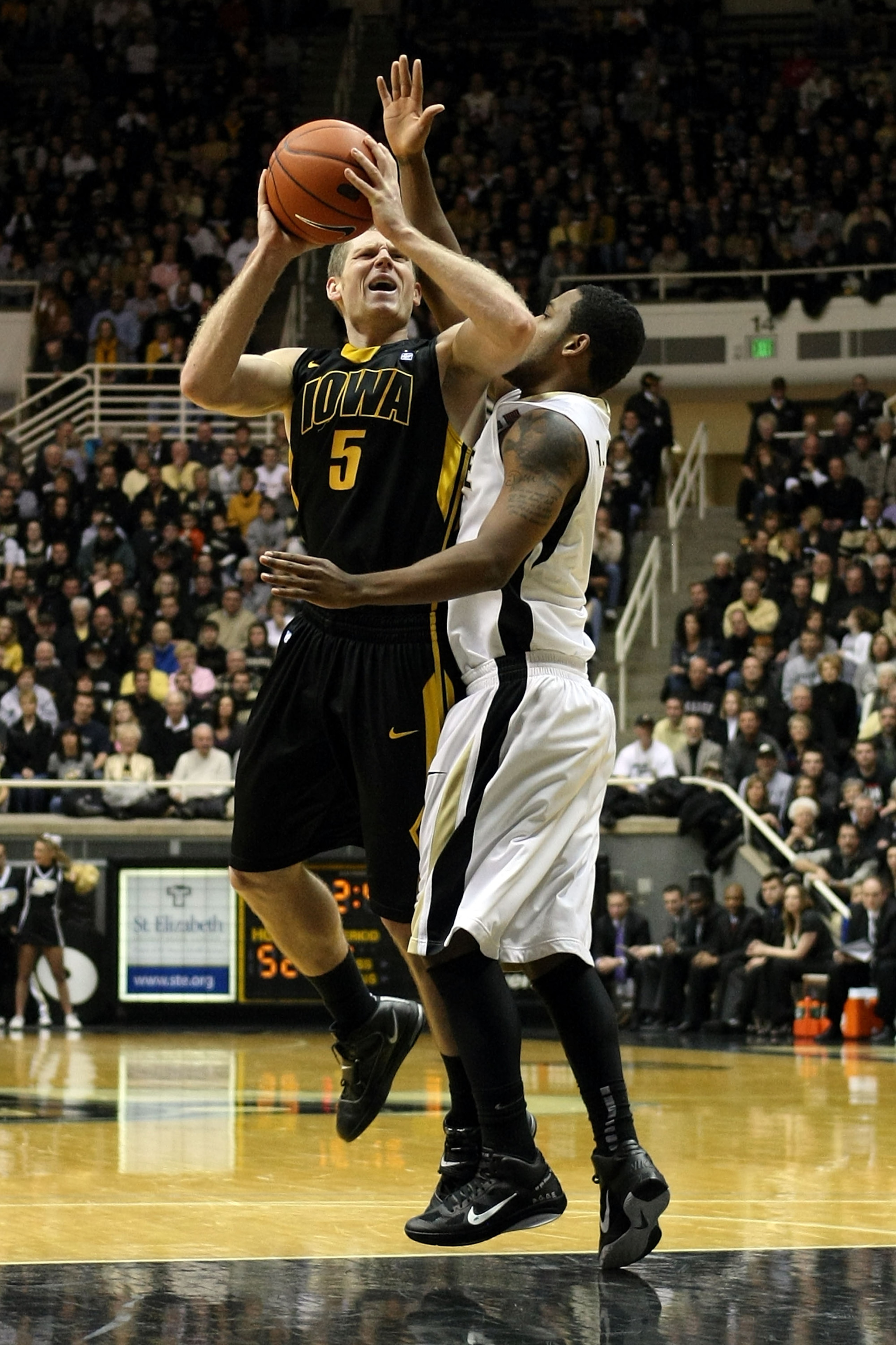 WEST LAFAYETTE, IN - JANUARY 09:  Matt Gatens #5 of the Iowa Hawkeyes attempts a shot against the Purdue Boilermakers at Mackey Arena on January 9, 2011 in West Lafayette, Indiana. Purdue won 75-52. (Photo by Chris Chambers/Getty Images)