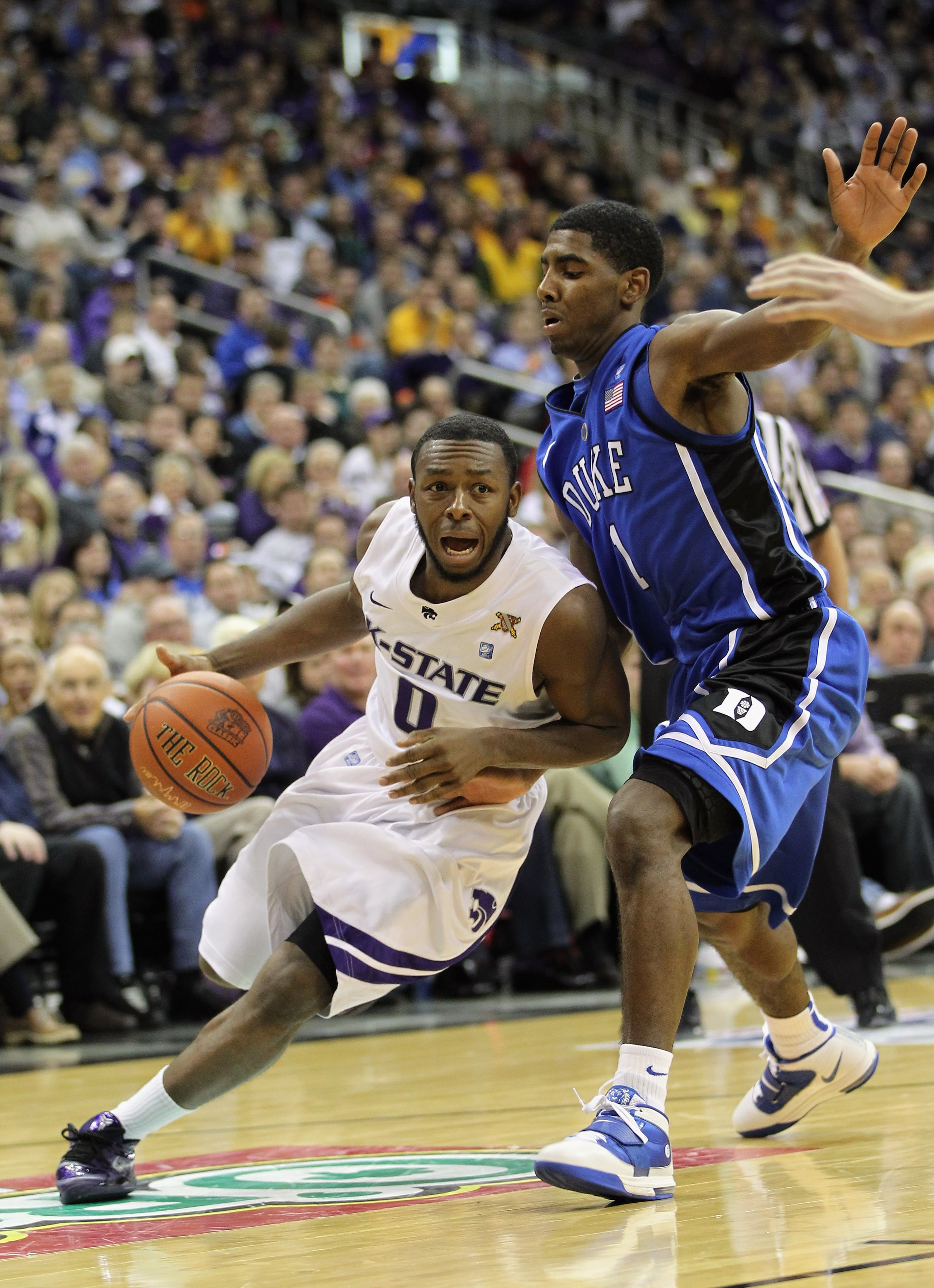 KANSAS CITY, MO - NOVEMBER 23:  Jacob Pullen #0 of the Kansas State Wildcats drives as Kyrie Irving #1 of the Duke Blue Devils defends during the CBE Classic championship game on November 23, 2010 at the Sprint Center in Kansas City, Missouri.  (Photo by
