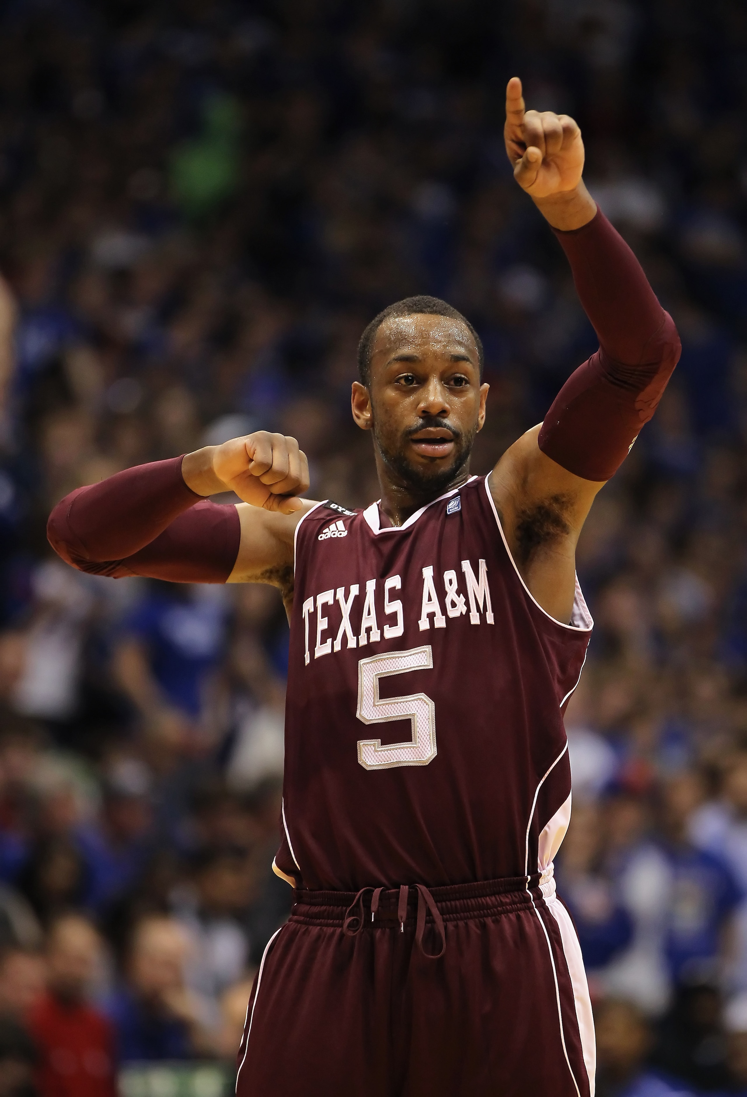 LAWRENCE, KS - MARCH 02:  Dash Harris #5 the Texas A&M Aggies reacts during the game against the Kansas Jayhawks on March 2, 2011 at Allen Fieldhouse in Lawrence, Kansas.  (Photo by Jamie Squire/Getty Images)