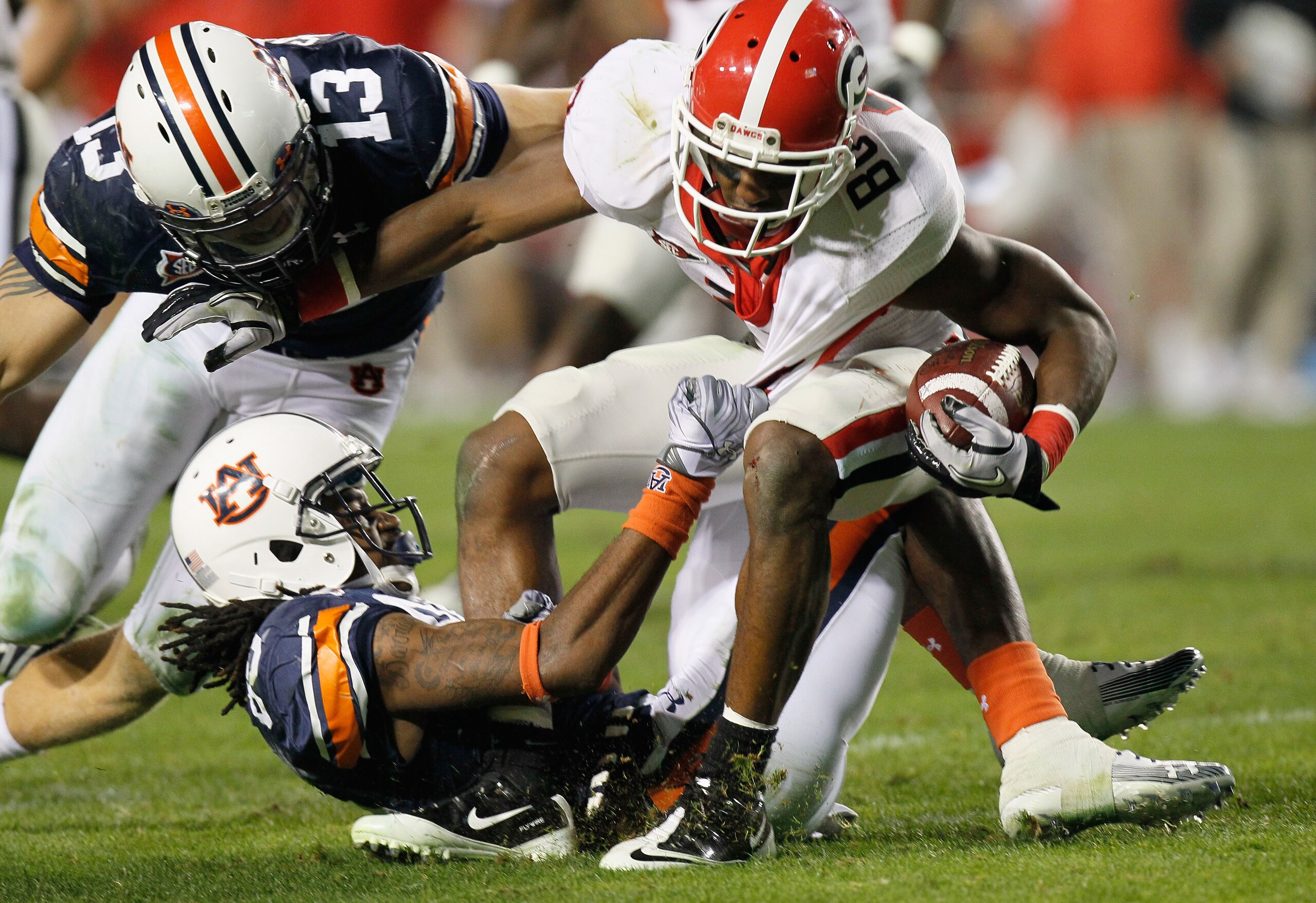 AUBURN, AL - NOVEMBER 13:  Craig Sanders #13 and Darvin Adams #89 of the Auburn Tigers against Brandon Boykin #2 of the Georgia Bulldogs at Jordan-Hare Stadium on November 13, 2010 in Auburn, Alabama.  (Photo by Kevin C. Cox/Getty Images)
