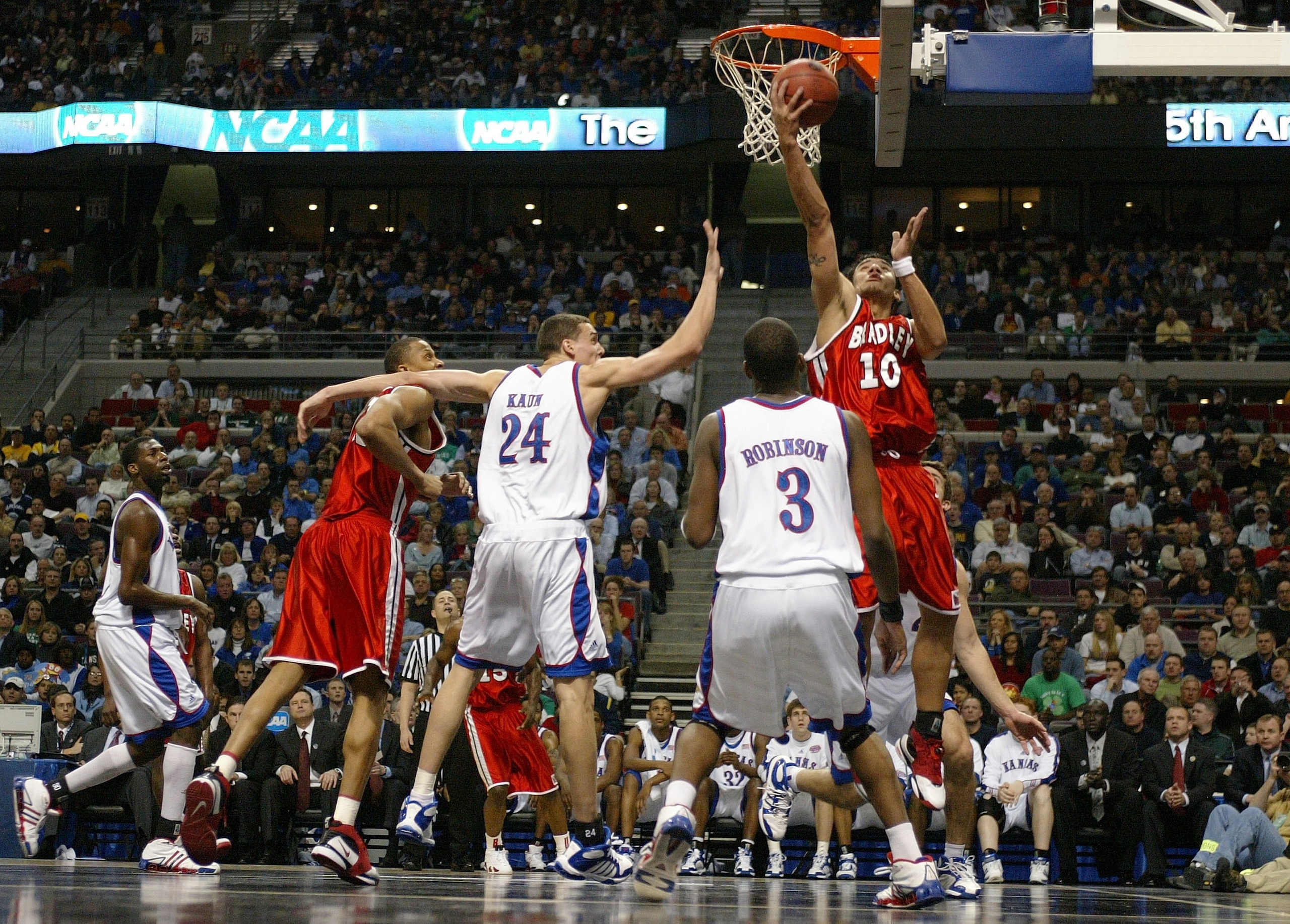 AUBURN HILLS, MI - MARCH 17:  J.J. Tauai #10 of the Bradley Braves shoots over the defense of Sasha Kaun #24 of the Kansas Jayhawks during the First Round of the 2006 NCAA Men's Basketball Tournament at The Palace of Auburn Hills on March 17, 2006 in Aubu