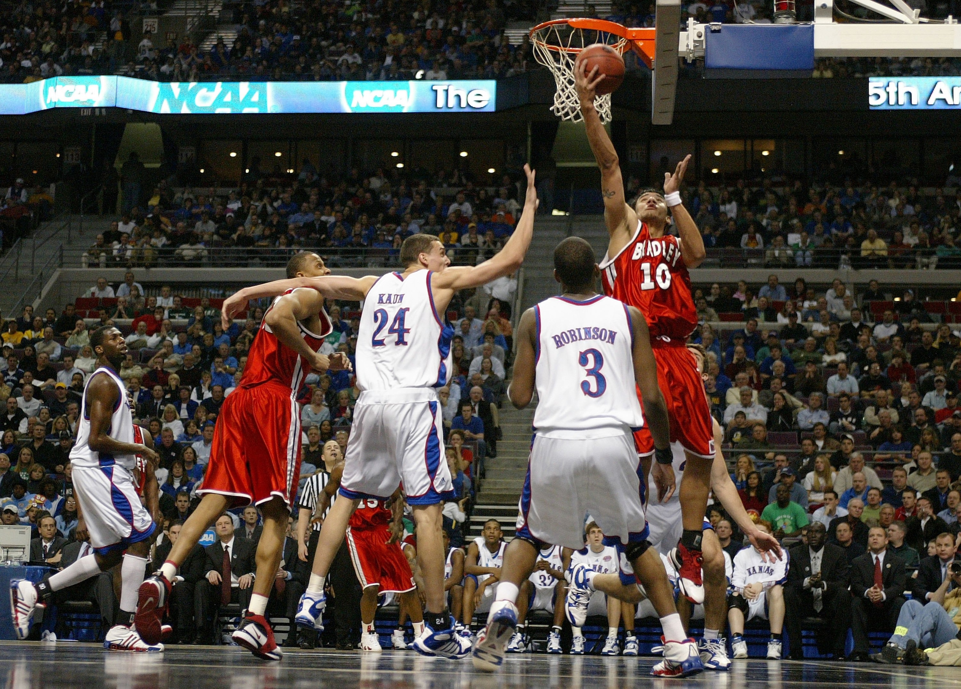 AUBURN HILLS, MI - MARCH 17:  J.J. Tauai #10 of the Bradley Braves shoots over the defense of Sasha Kaun #24 of the Kansas Jayhawks during the First Round of the 2006 NCAA Men's Basketball Tournament at The Palace of Auburn Hills on March 17, 2006 in Aubu