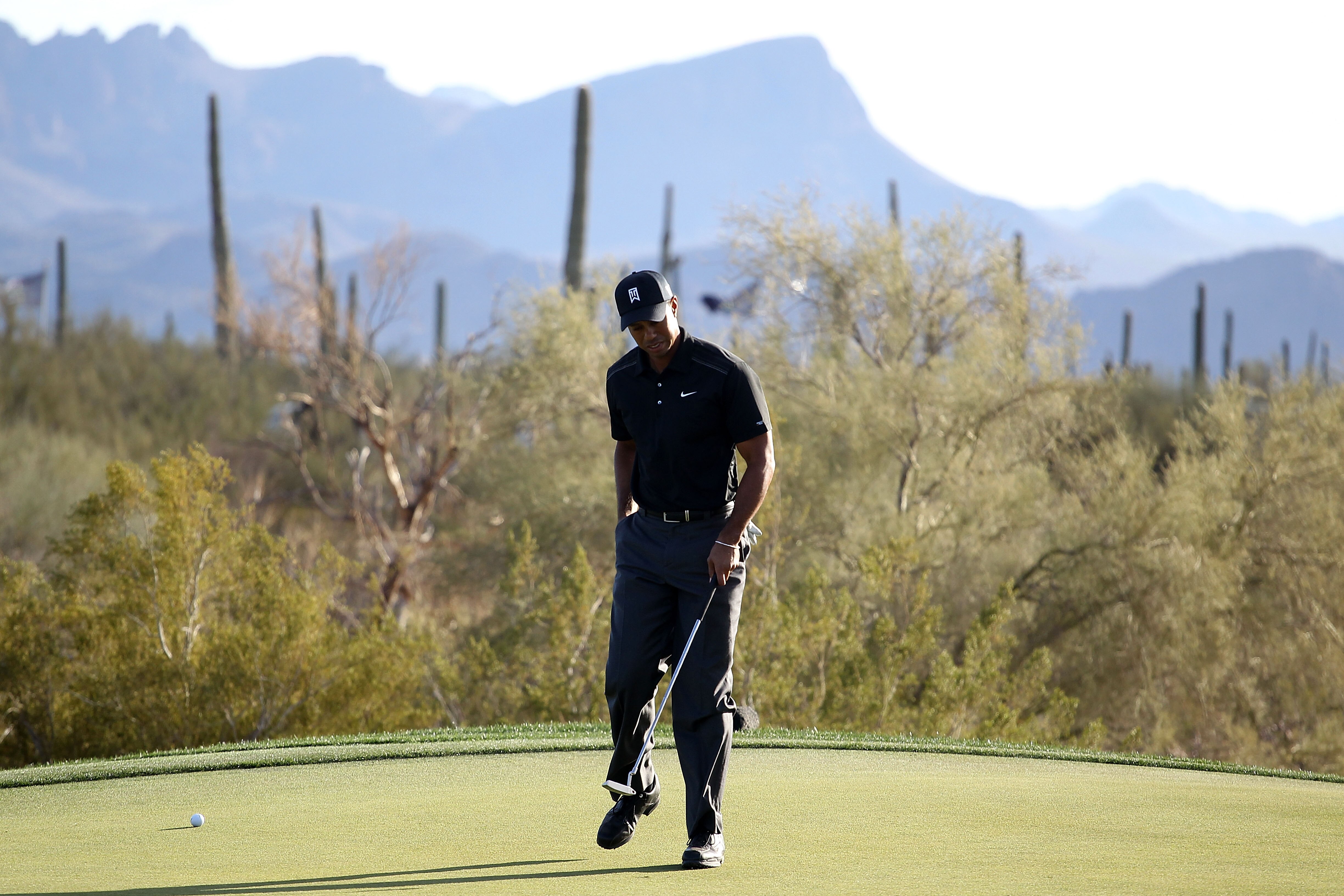 MARANA, AZ - FEBRUARY 23:  Tiger Woods reacts during the first round of the Accenture Match Play Championship at the Ritz-Carlton Golf Club on February 23, 2011 in Marana, Arizona.  (Photo by Andy Lyons/Getty Images)