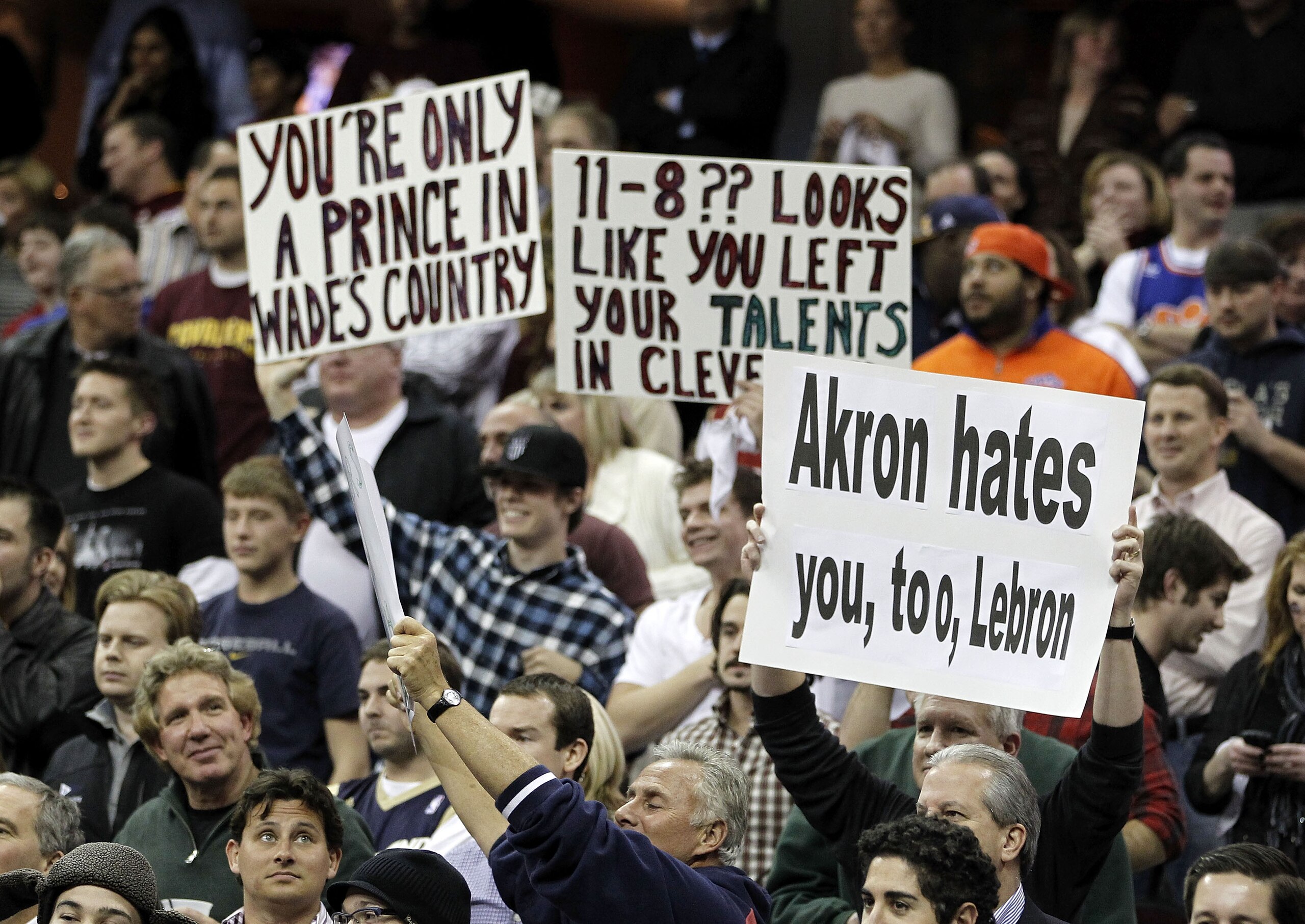 CLEVELAND, OH - DECEMBER 02:  Fans hold up signs prior to the Cleveland Cavaliers playing the Miami Heat at Quicken Loans Arena on December 2, 2010 in Cleveland, Ohio. NOTE TO USER: User expressly acknowledges and agrees that, by downloading and or using