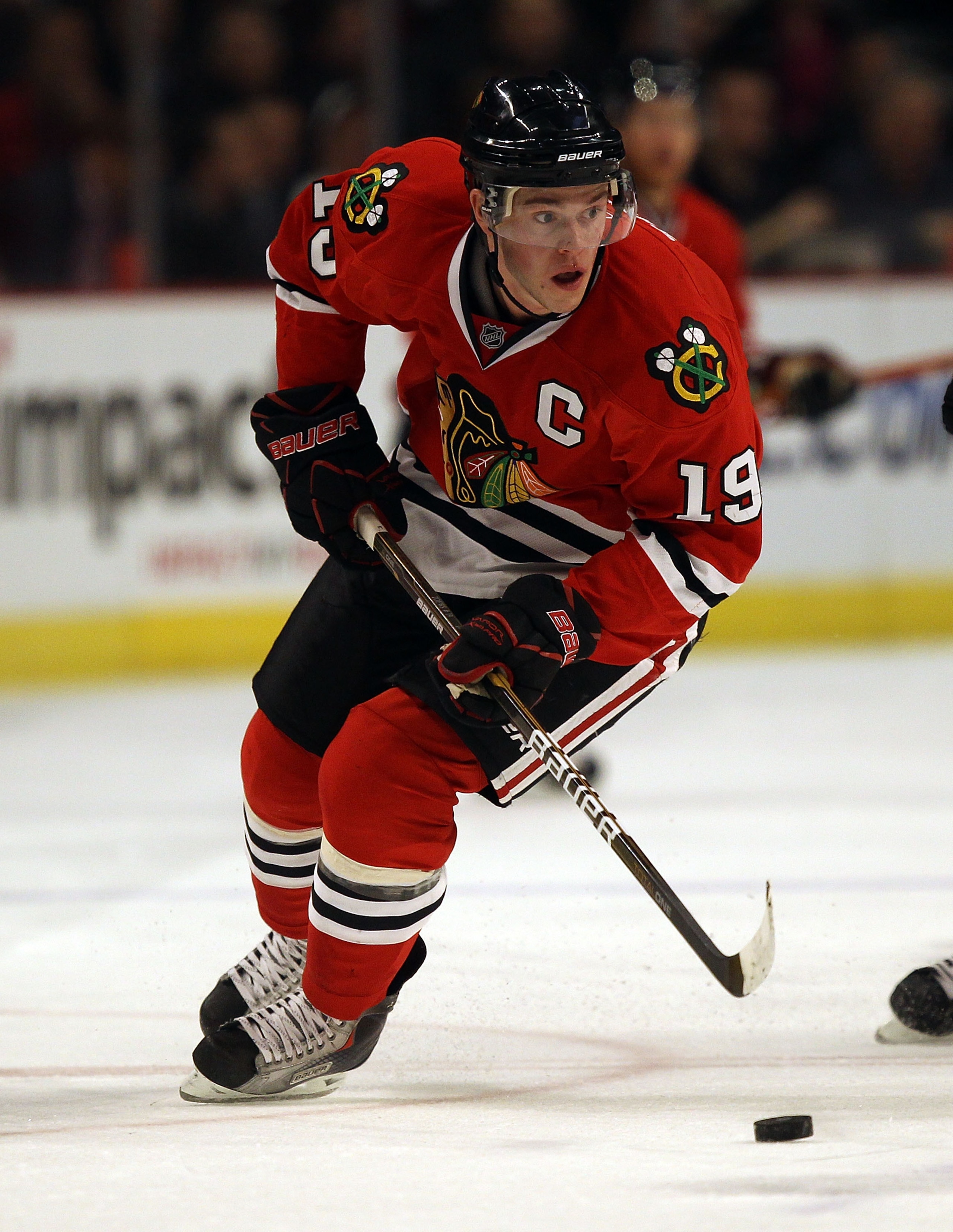 CHICAGO, IL - MARCH 02: Jonathan Toews #19 of the Chicago Blackhawks controls the puck against the Calgary Flames at the United Center on March 2, 2011 in Chicago, Illinois. The Blackhawks defeated the Flames 6-4. (Photo by Jonathan Daniel/Getty Images) CHICAGO, IL - MARCH 02: Jonathan Toews #19 of the Chicago Blackhawks controls the puck against the Calgary Flames at the United Center on March 2, 2011 in Chicago, Illinois. The Blackhawks defeated the Flames 6-4. (Photo by Jonathan Daniel/Getty Images)