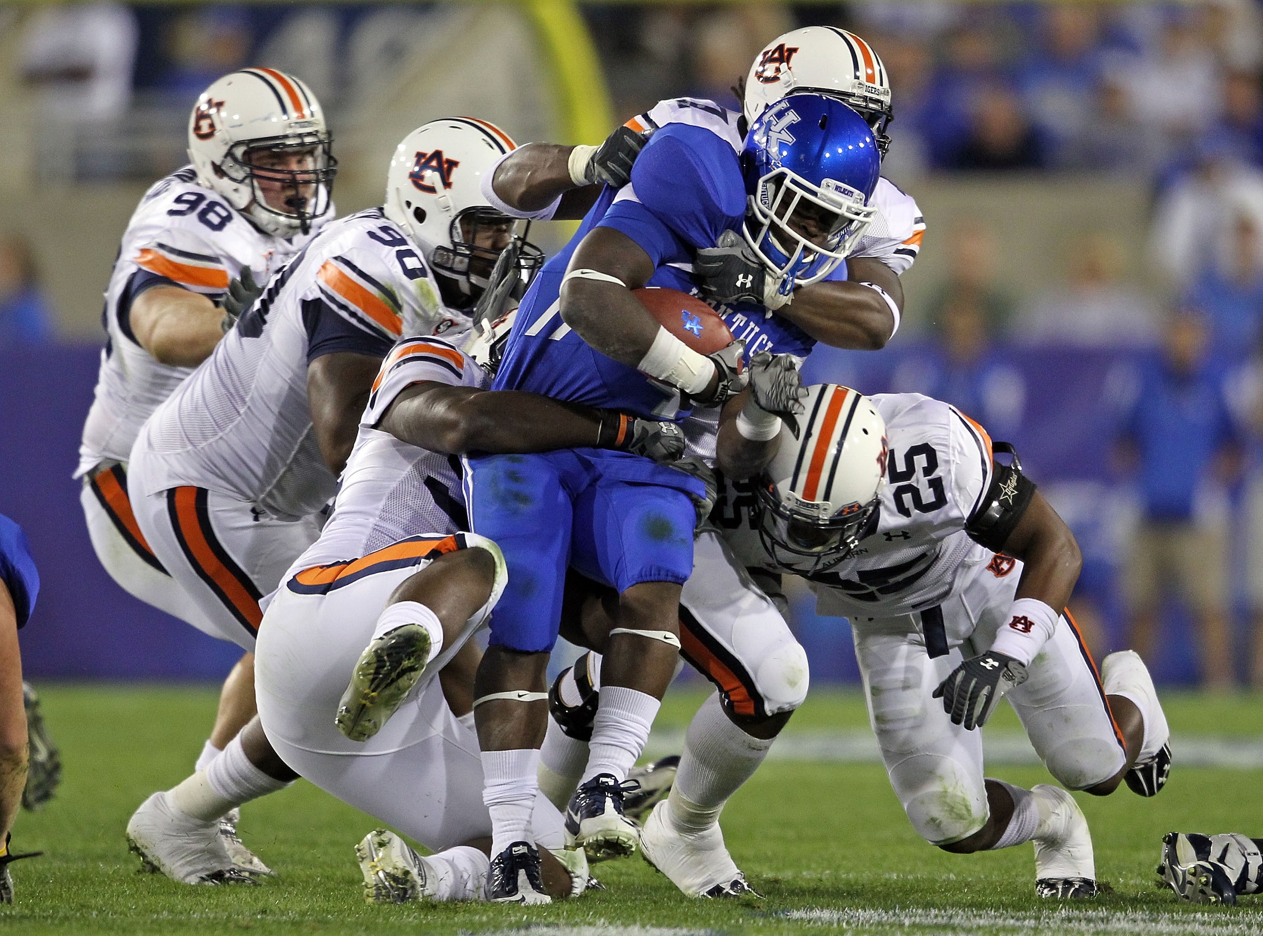 LEXINGTON, KY - OCTOBER 09: Raymond Sanders #4 of the Kentucky Wildcats is tackled by the Auburn Tigers defense during the SEC game at Commonwealth Stadium on October 9, 2010 in Lexington, Kentucky.  (Photo by Andy Lyons/Getty Images)
